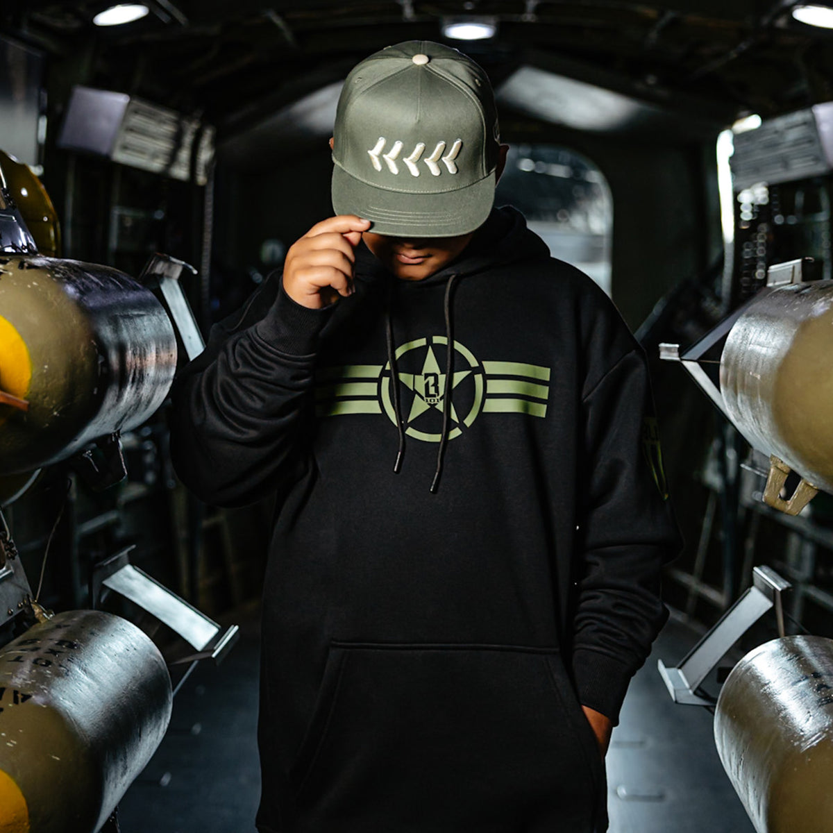 Youth model wearing black Field General BL Black youth hoodie