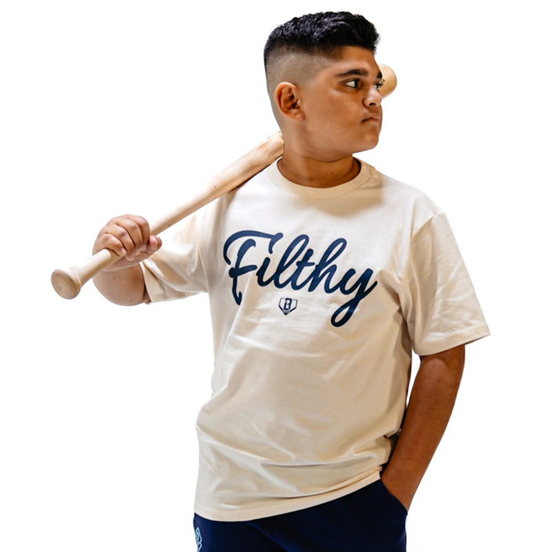 Person wearing a beige t-shirt with dark blue 'Filthy' printed on it, holding a baseball bat.