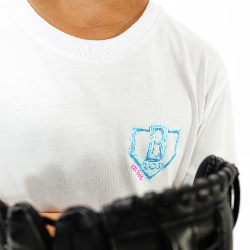 Youth model wearing white youth graphic tee with "10 Year Anniversary" design