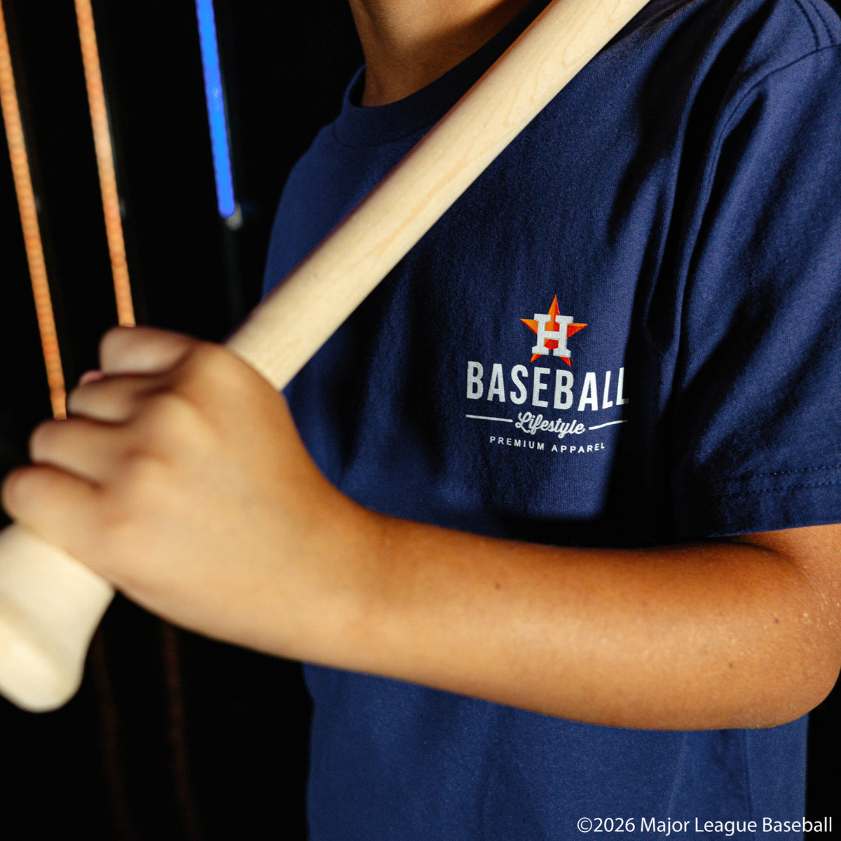 Youth model wearing navy youth graphic tee with "Houston Astros Ice Cream" design