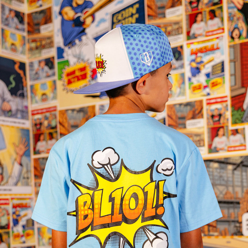 Youth model wearing blue hat with "BL101 Comic" design