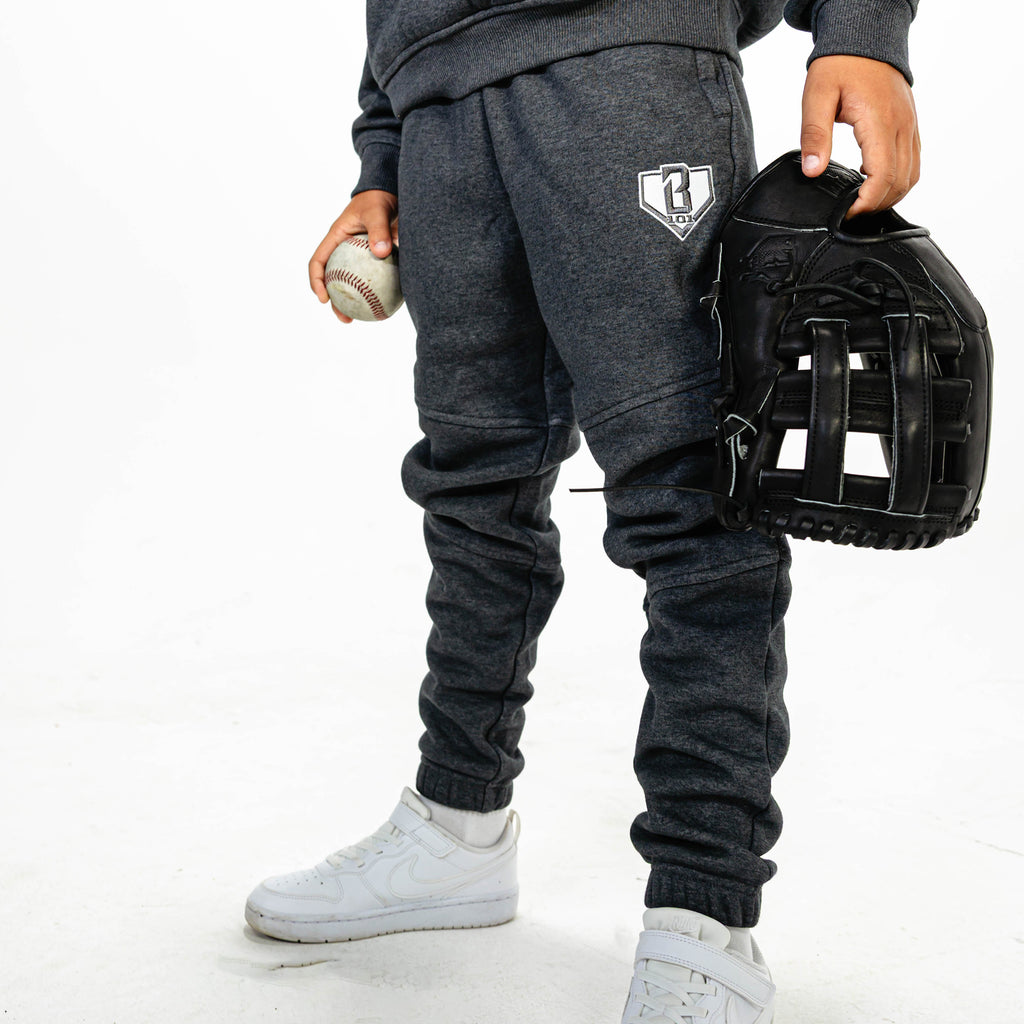 Youth model wearing Gray Baseline joggers