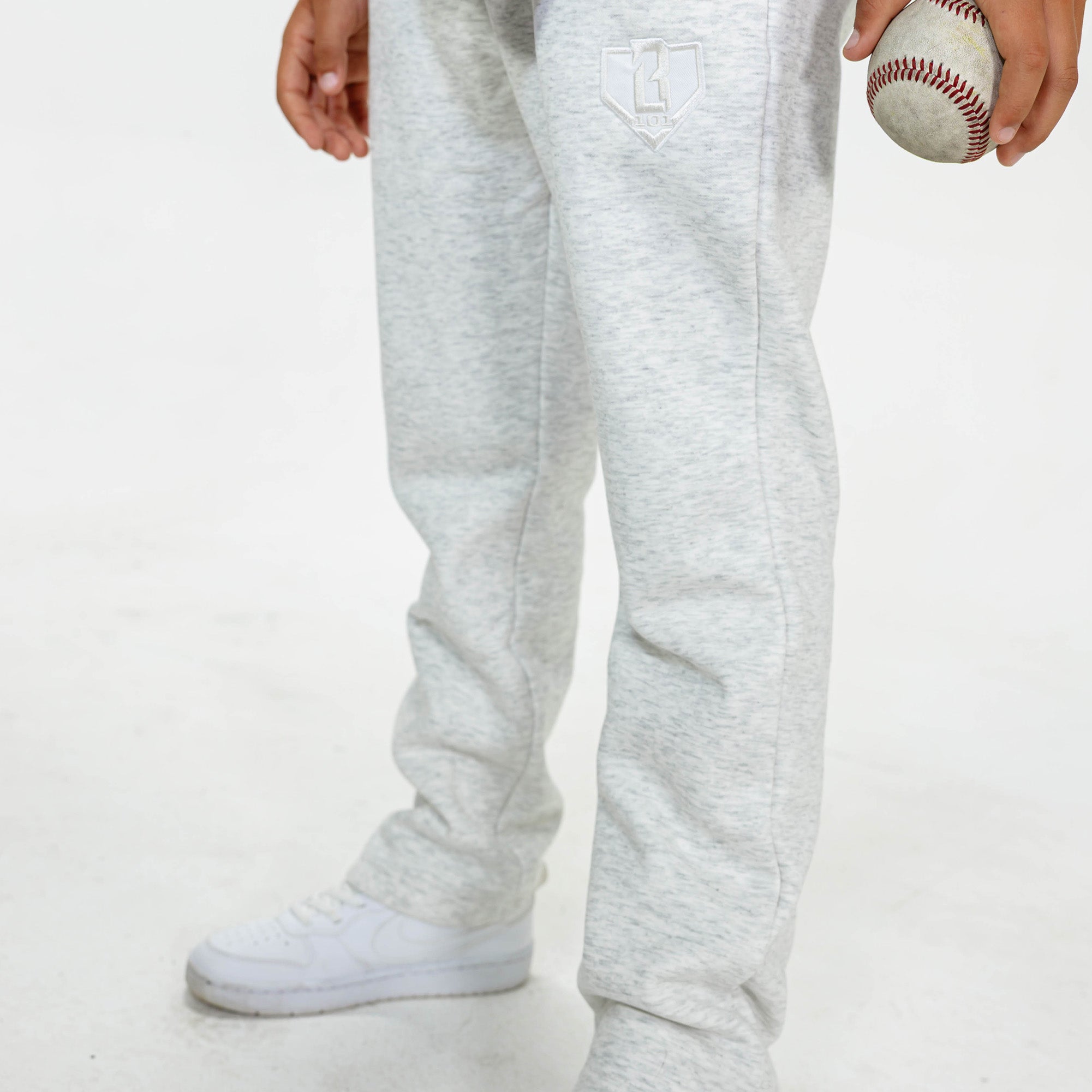 Youth model wearing Gray Baseline Straight Leg sweatpants
