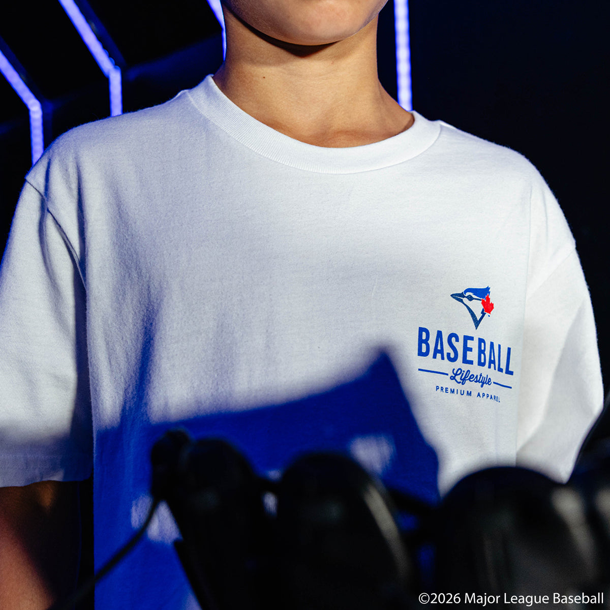 Youth model wearing white youth graphic tee with "Toronto Blue Jays Ice Cream" design