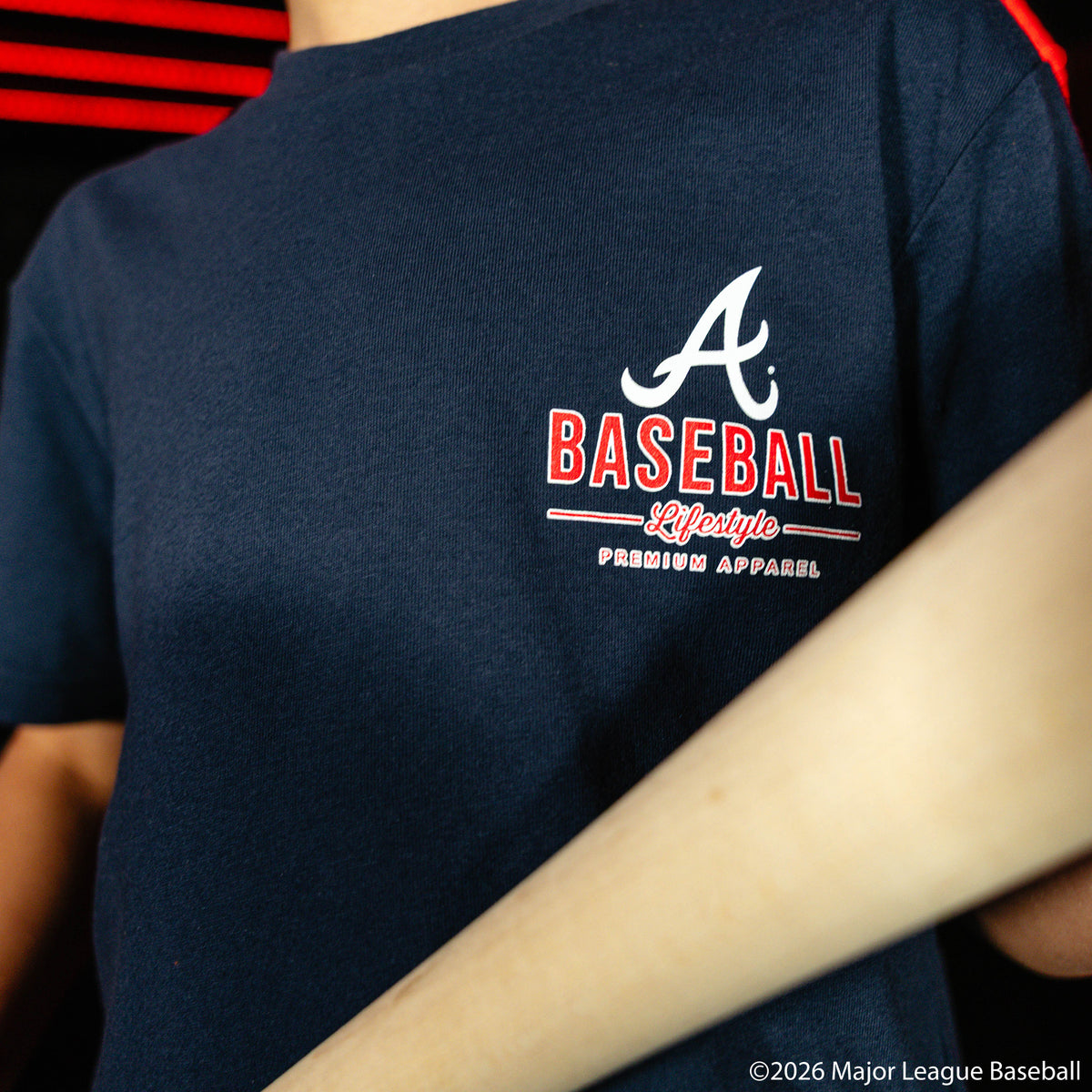 Youth model wearing navy youth graphic tee with "Atlanta Braves Ice Cream" design