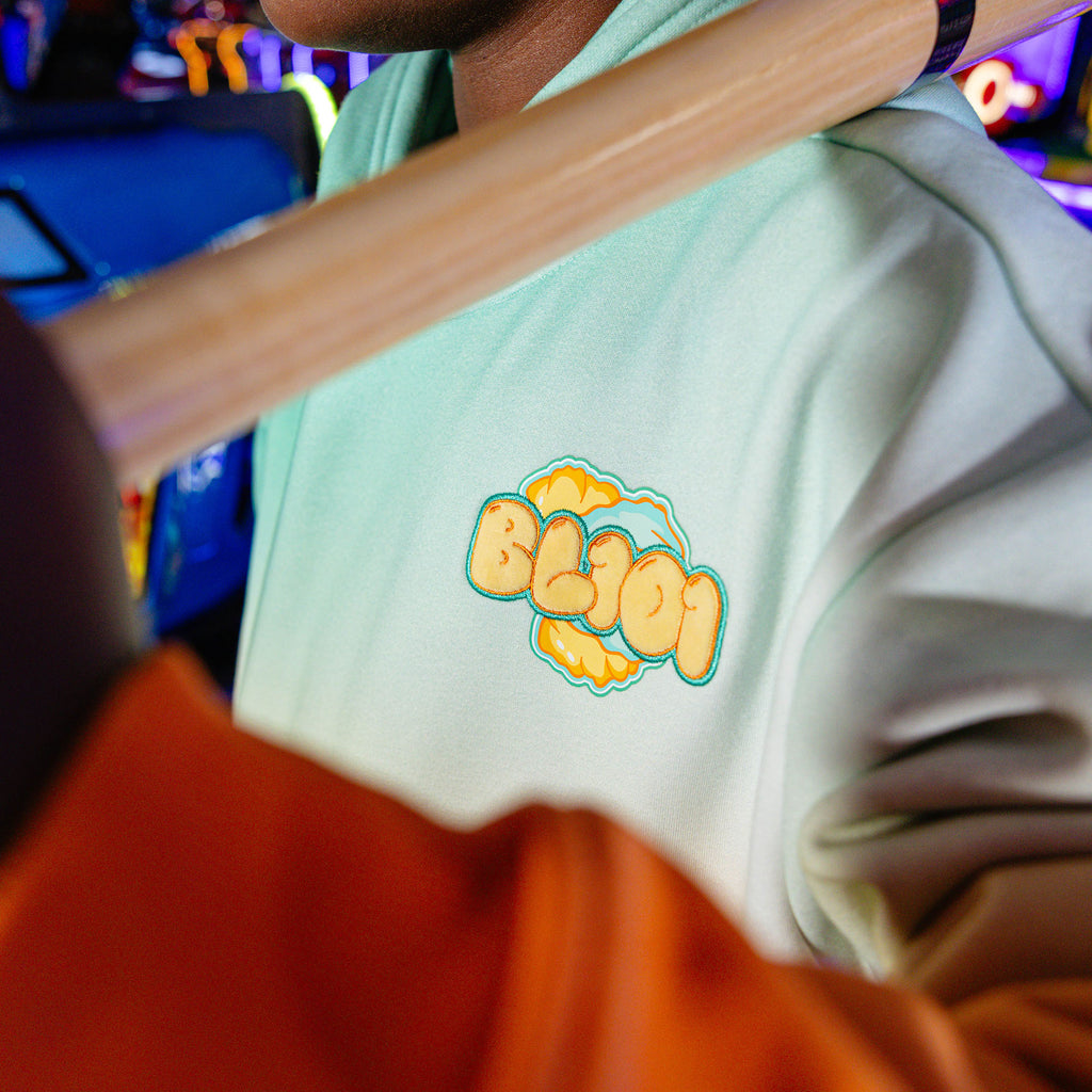 Youth model wearing Cotton Candy Tangerine Freeze youth hoodie