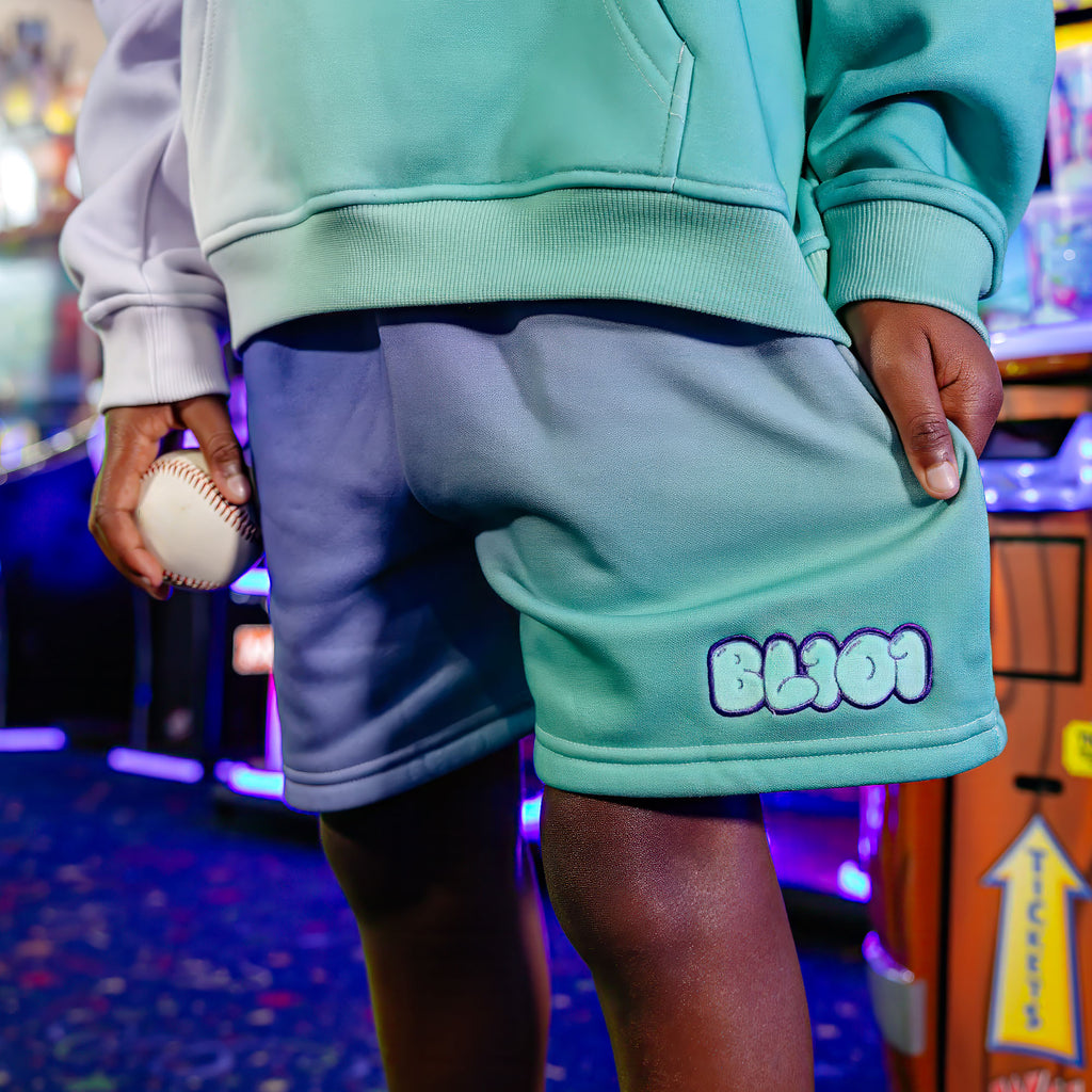 Youth model wearing Cotton Candy Galaxy Grape youth shorts