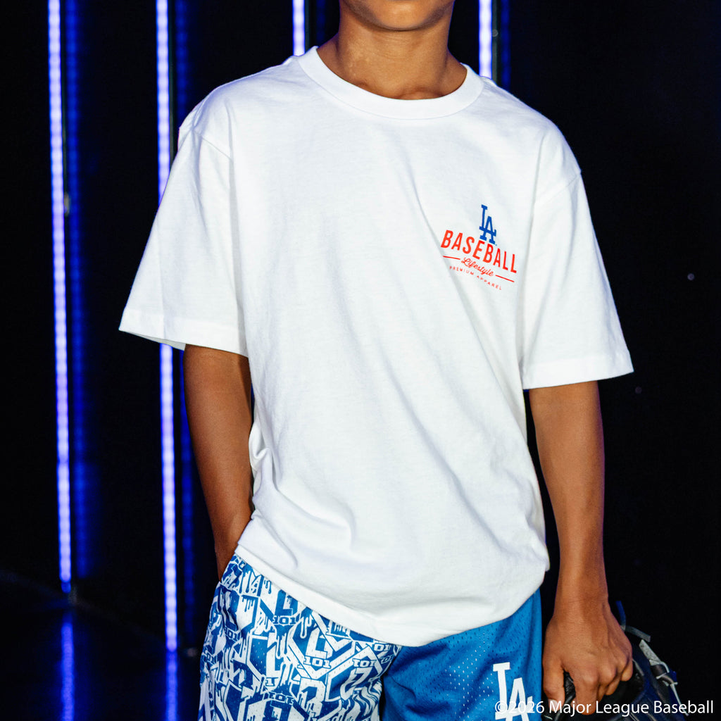 Youth model wearing white youth graphic tee with "Los Angeles Dodgers Ice Cream" design