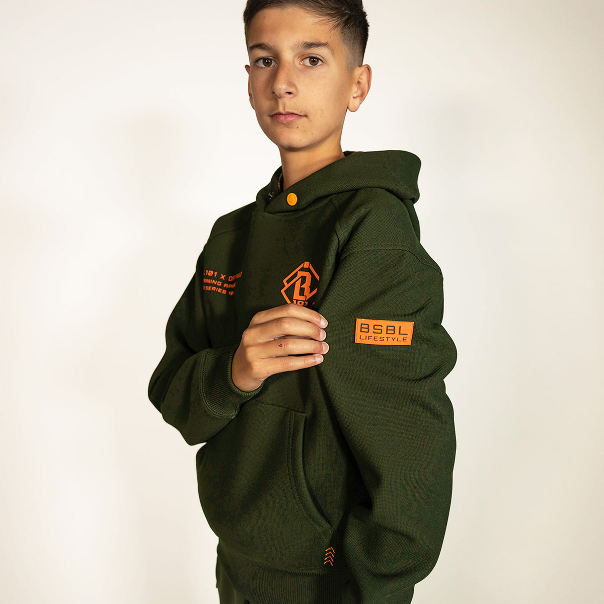 Youth model wearing green Realtree Legacy Off-Field Waffle Performance Camo youth hoodie