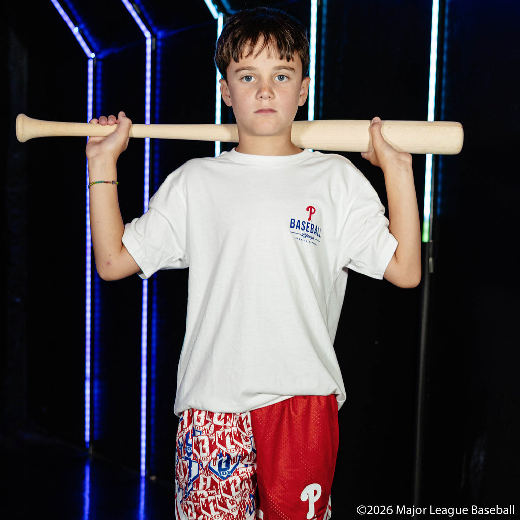 Youth model wearing white youth graphic tee with "Philadelphia Phillies Ice Cream Cap" design