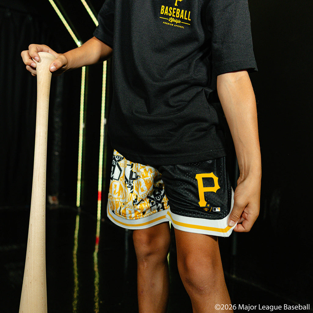 Youth model wearing black youth shorts with "Pittsburgh Pirates Sticker Court" design