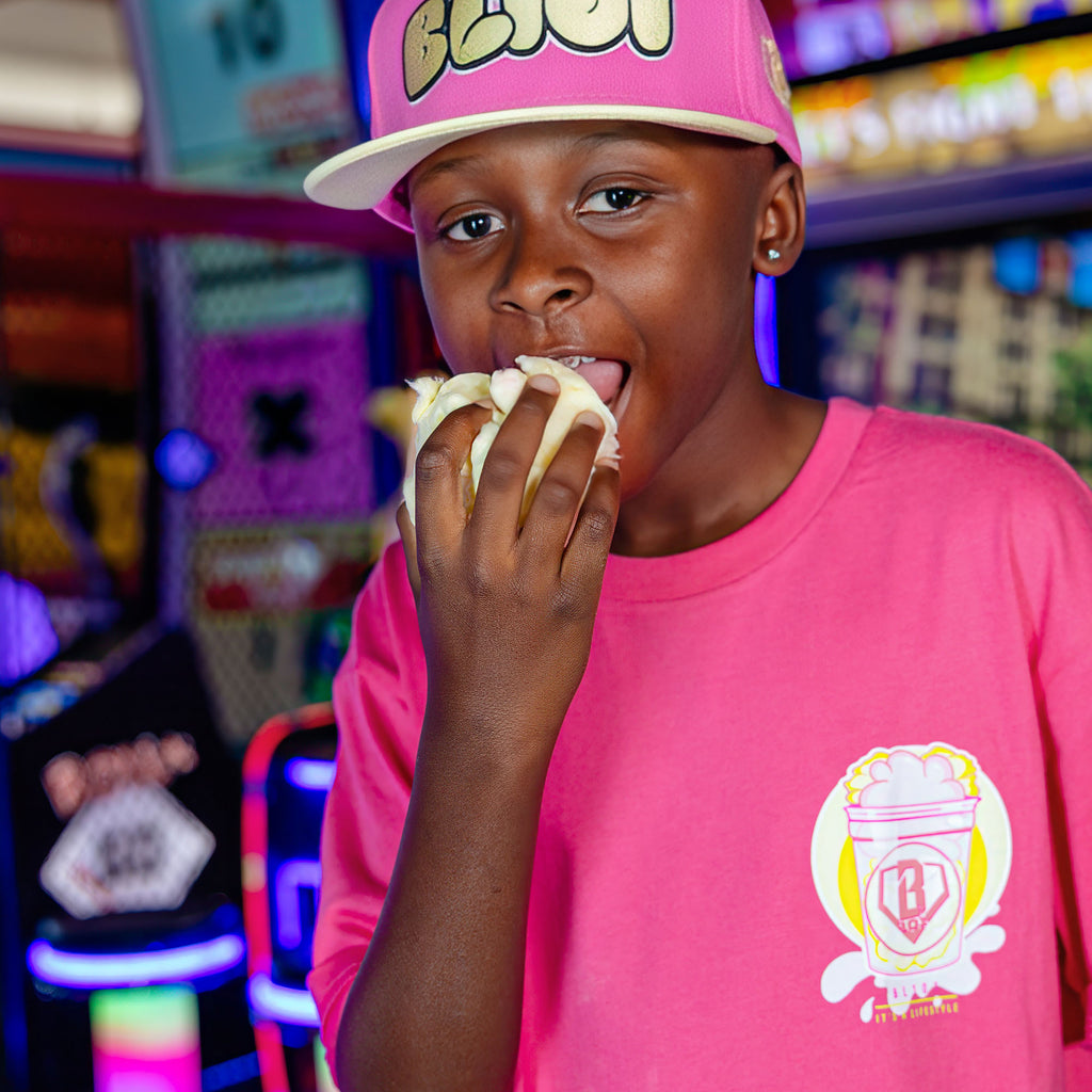Youth model wearing Sweet Spot Pink Lemonade youth graphic tee