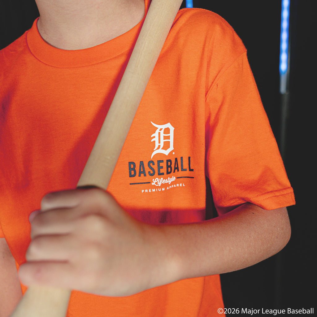 Youth model wearing orange youth graphic tee with "Detroit Tigers Ice Cream Cap" design