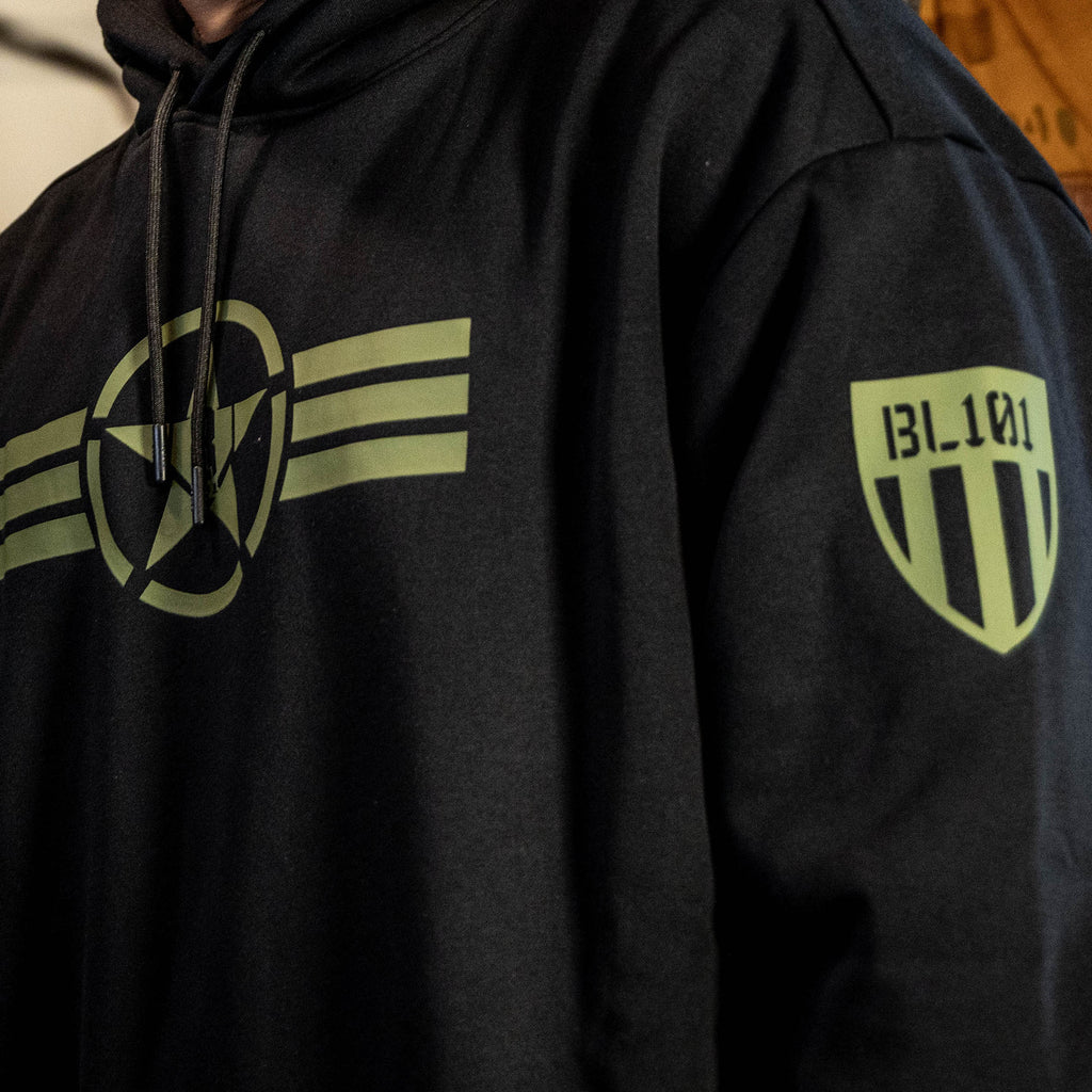 Youth model wearing black Field General BL Black youth hoodie