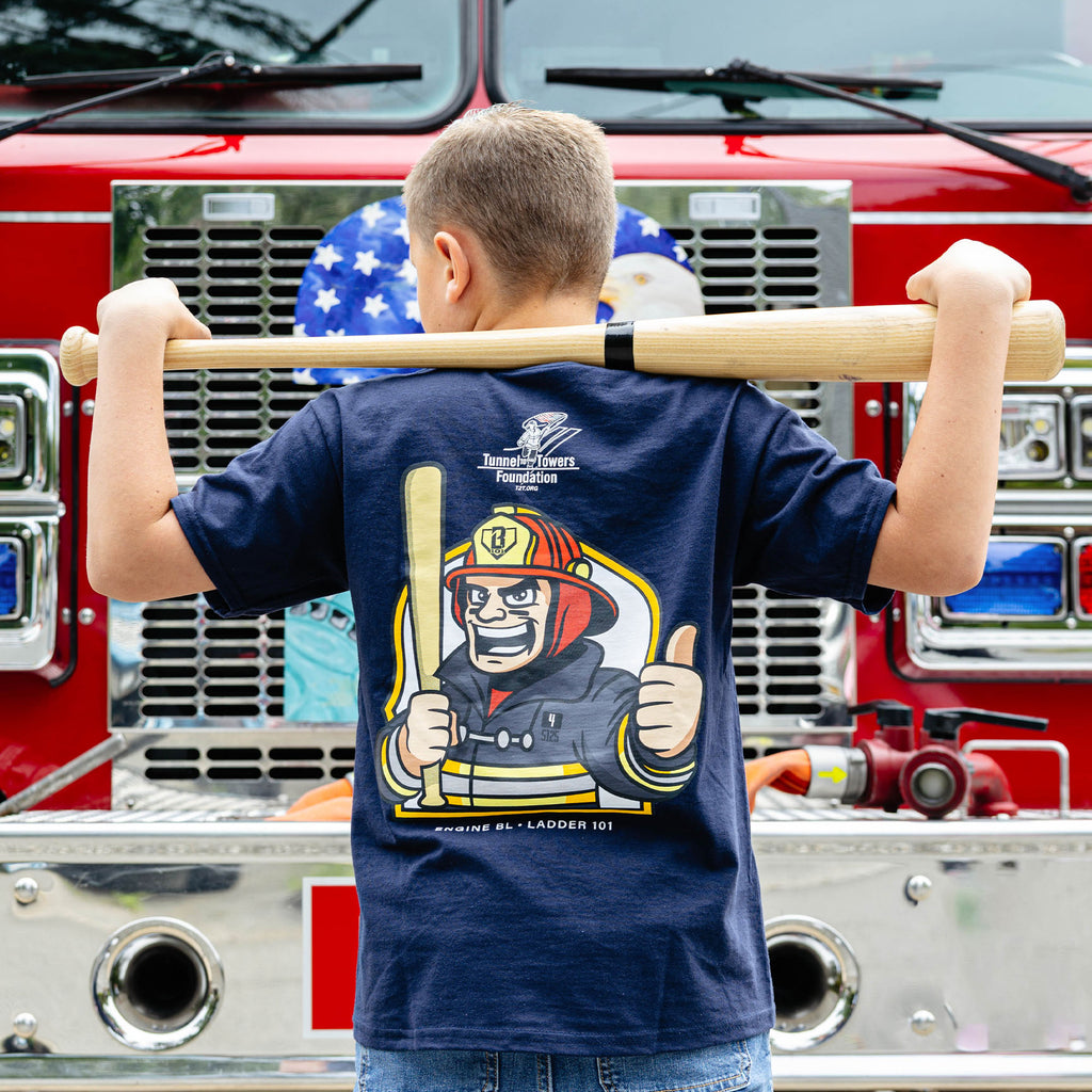 Youth model wearing Navy youth graphic tee with "BL101 X Tunnel to Towers Foundation" design