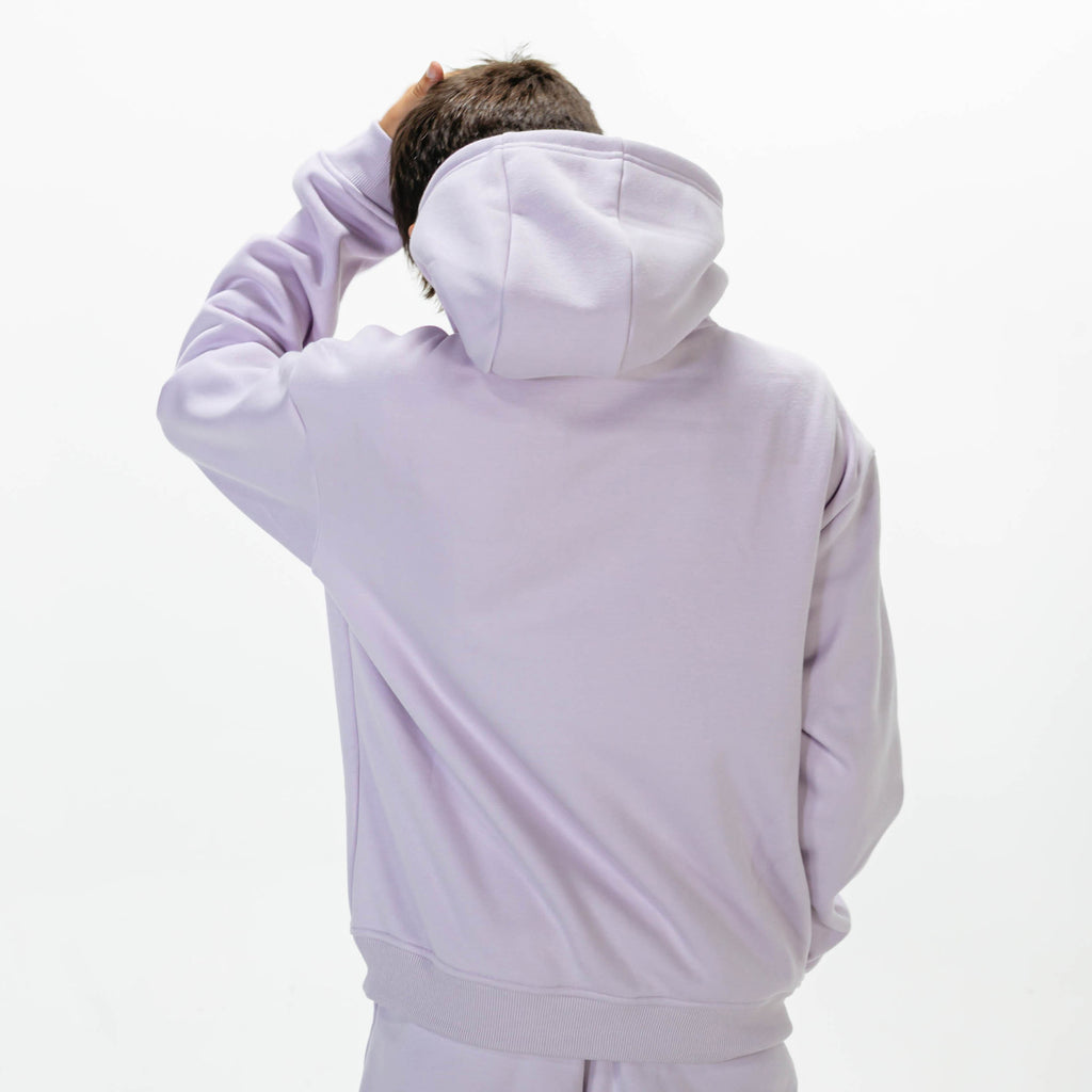 Youth model wearing Purple Baseline hoodie