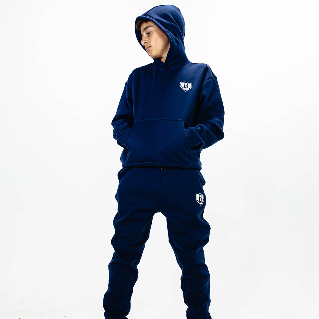 Youth model wearing Navy Baseline joggers