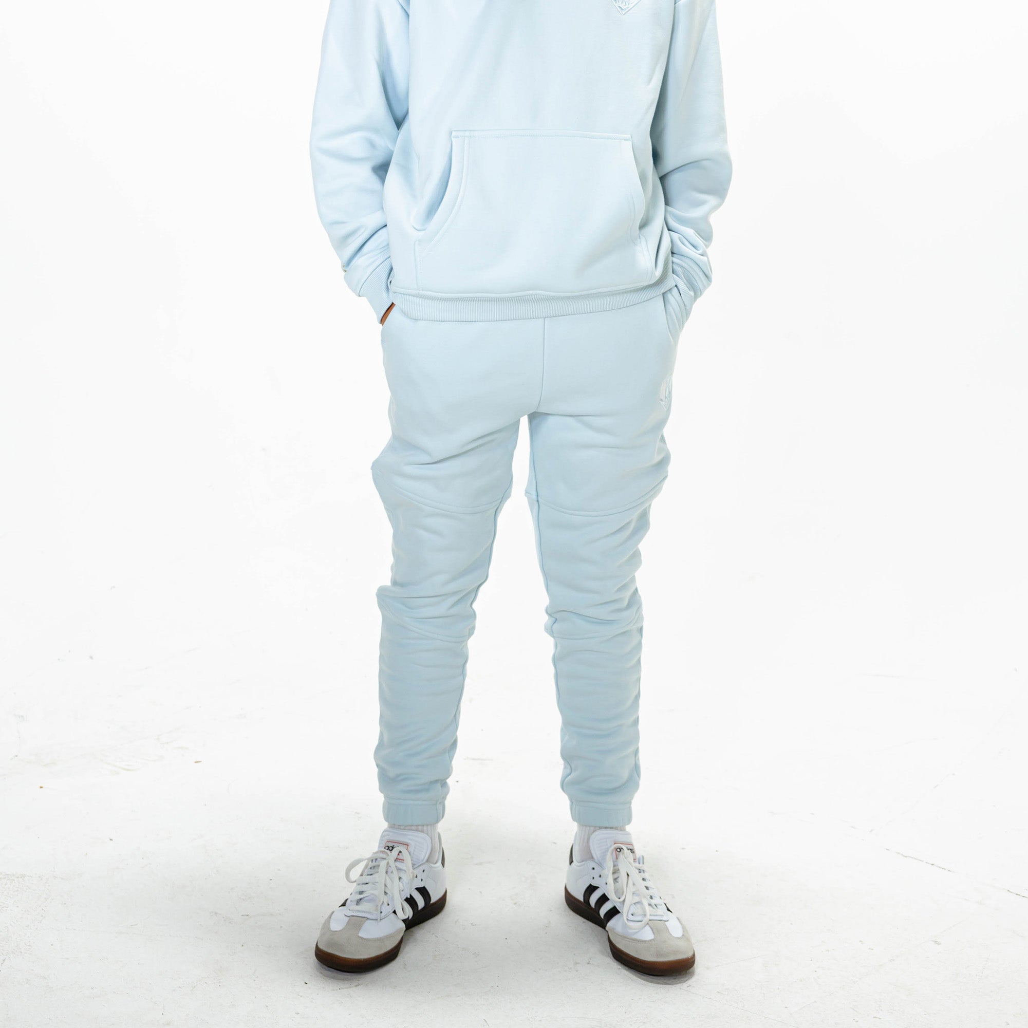 Youth model wearing Blue Baseline joggers