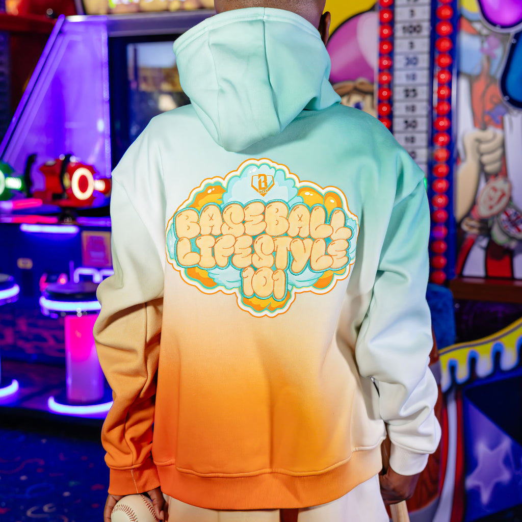 Youth model wearing Cotton Candy Tangerine Freeze youth hoodie