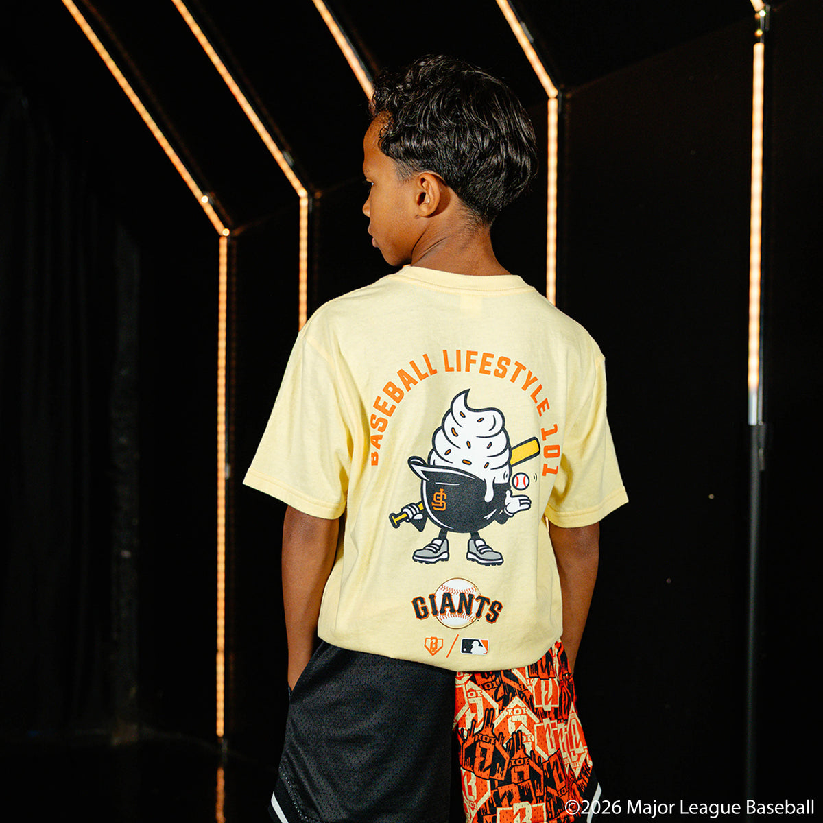 Youth model wearing cream youth graphic tee with "San Francisco Giants Ice Cream" design