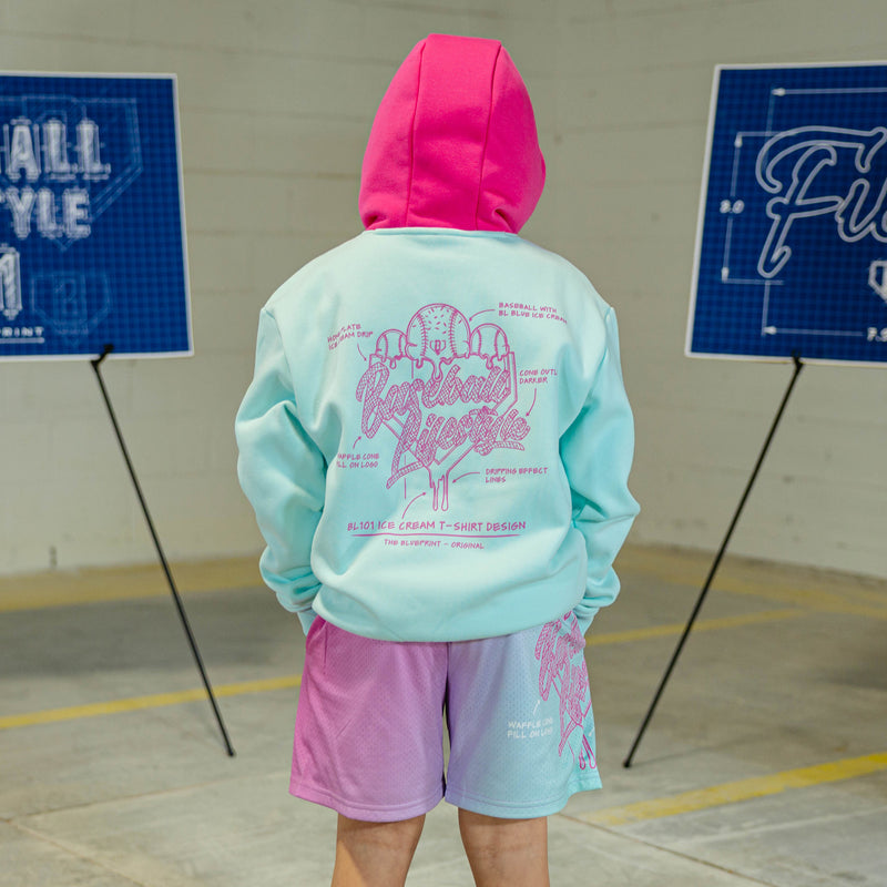 Child in light blue hoodie with pink hood and pink BL101 Ice cream logo