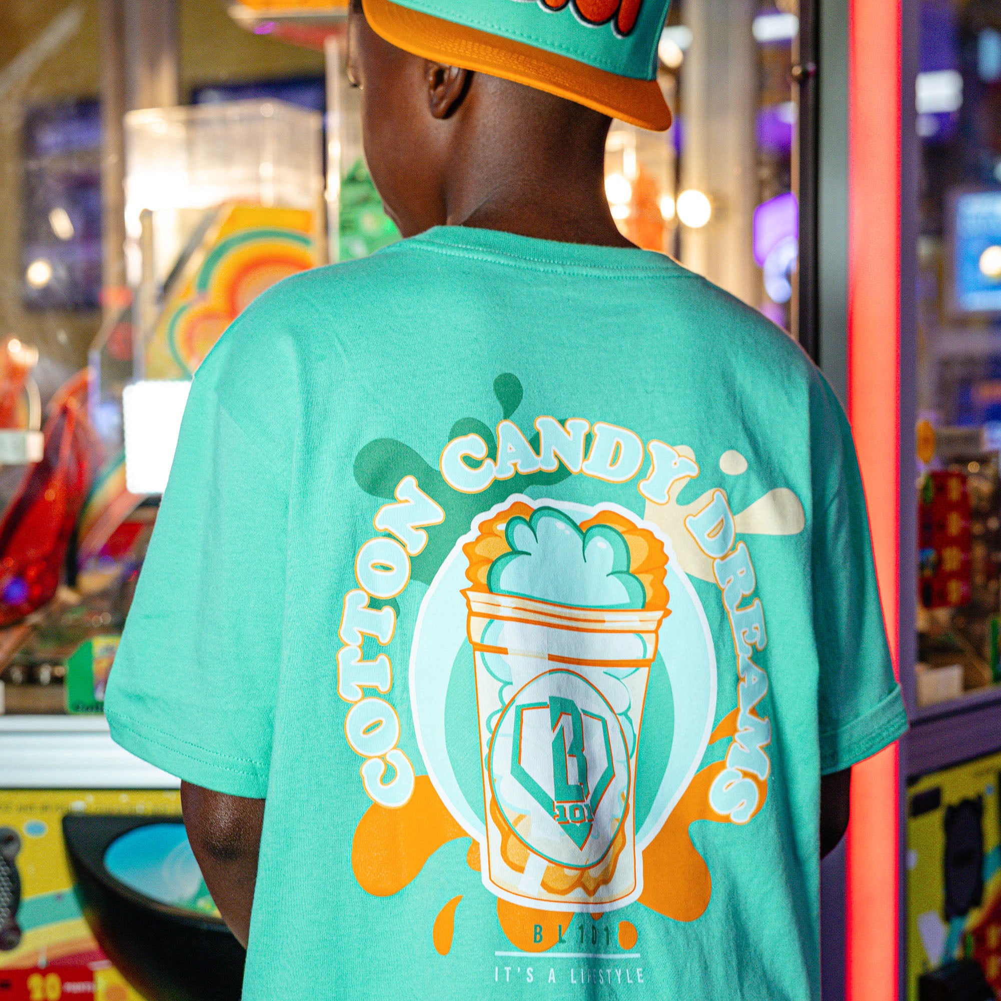 Youth model wearing Sweet Spot Tangerine Freeze youth graphic tee