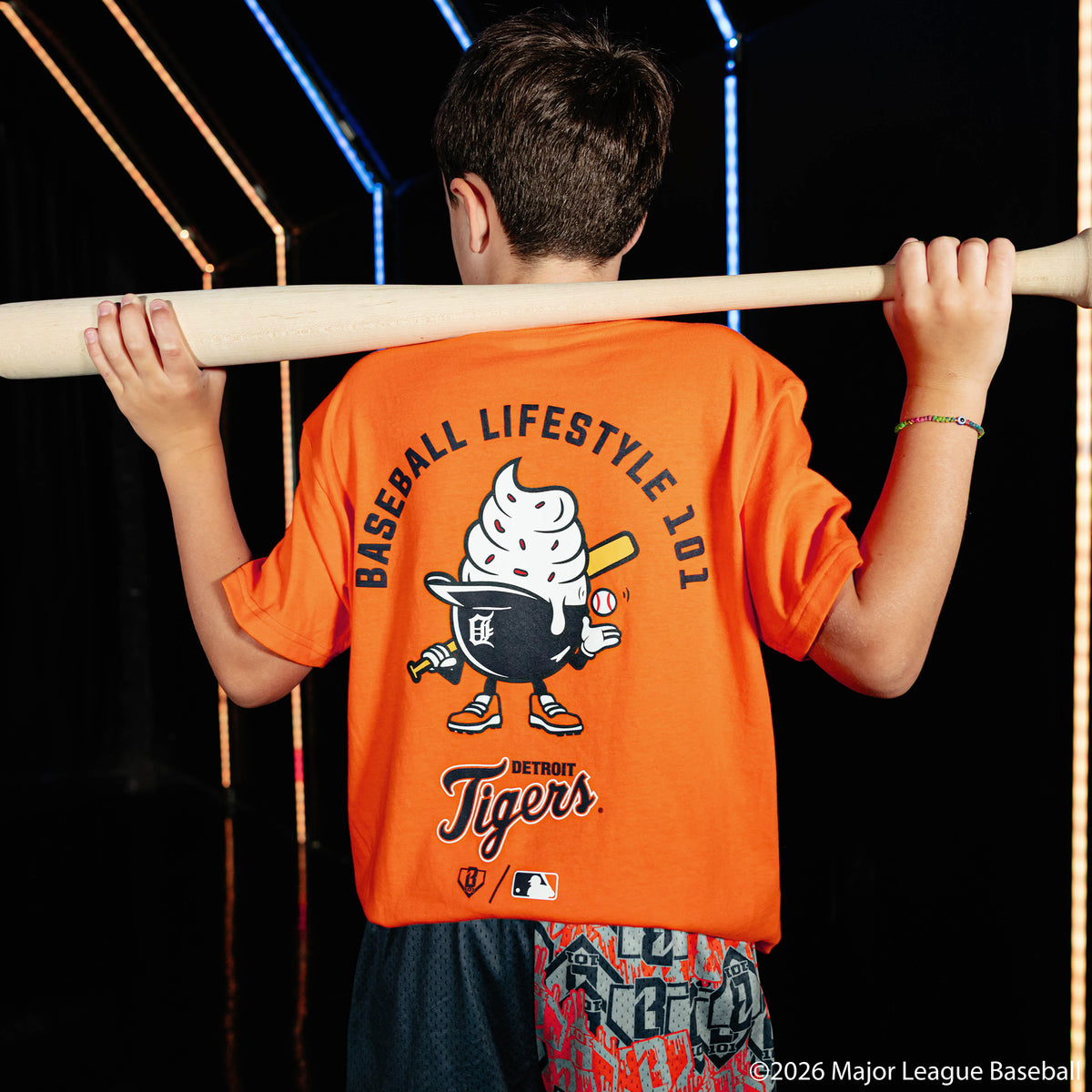 Youth model wearing orange youth graphic tee with "Detroit Tigers Ice Cream Cap" design
