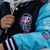 Person wearing a black and blue jacket with colorful ice cream cone design and BL101 Logo