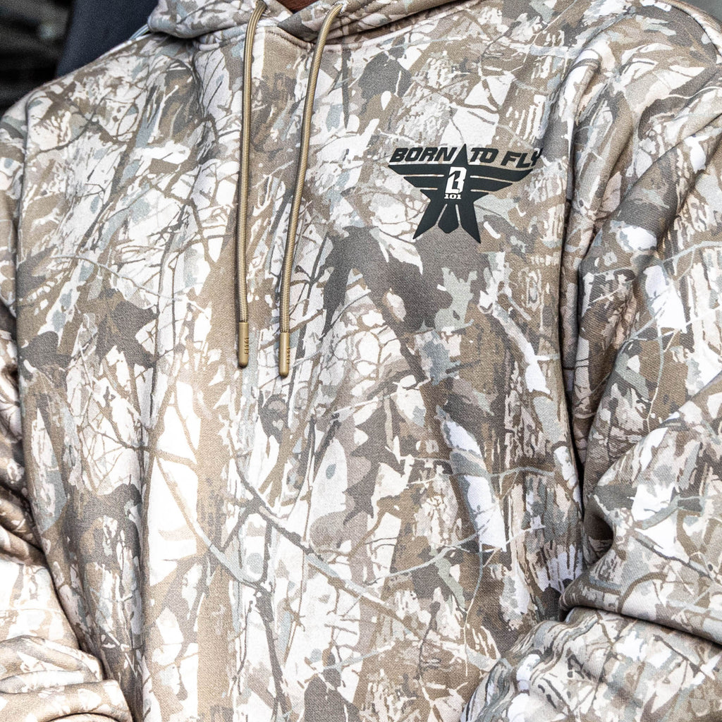 Close up of Camouflage hoodie with a brand logo on a neutral background