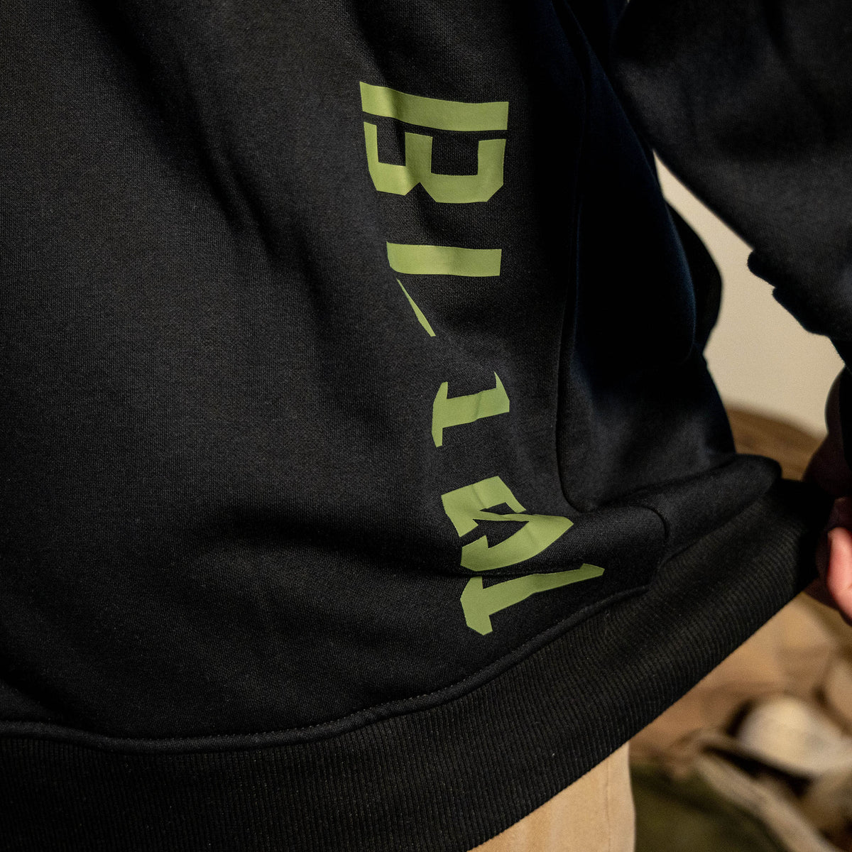 Youth model wearing black Field General BL Black youth hoodie