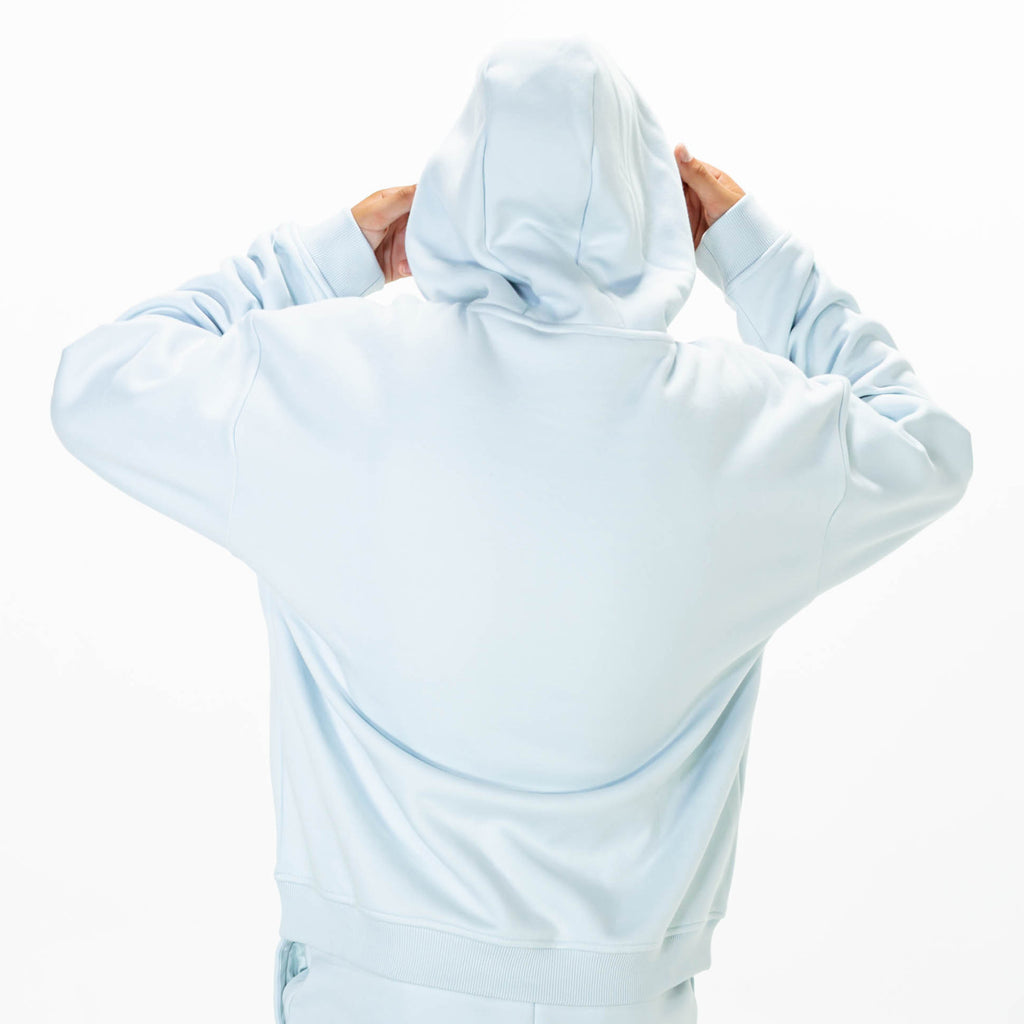 Youth model wearing Blue Baseline hoodie