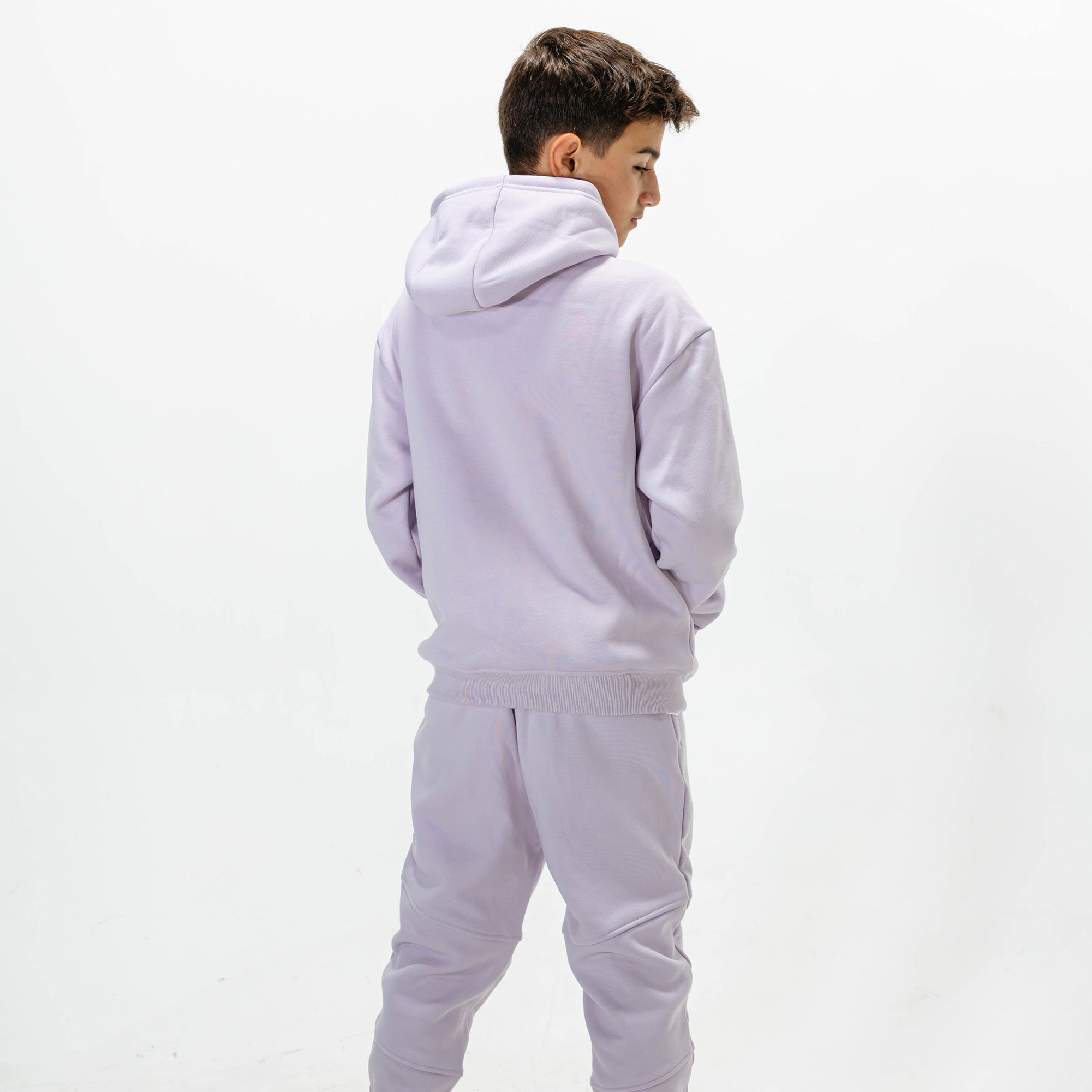 Youth model wearing Purple Baseline joggers