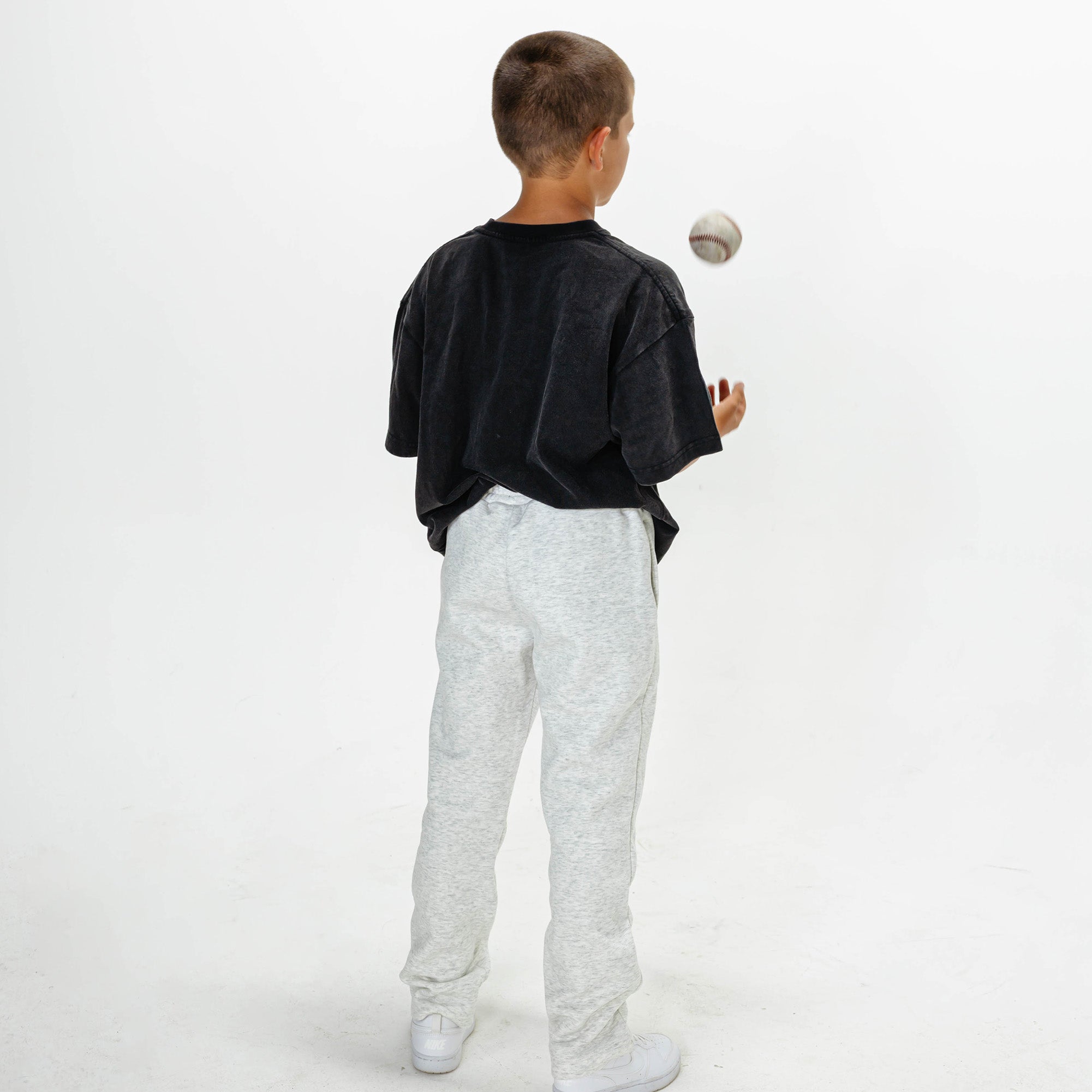 Youth model wearing Gray Baseline Straight Leg sweatpants