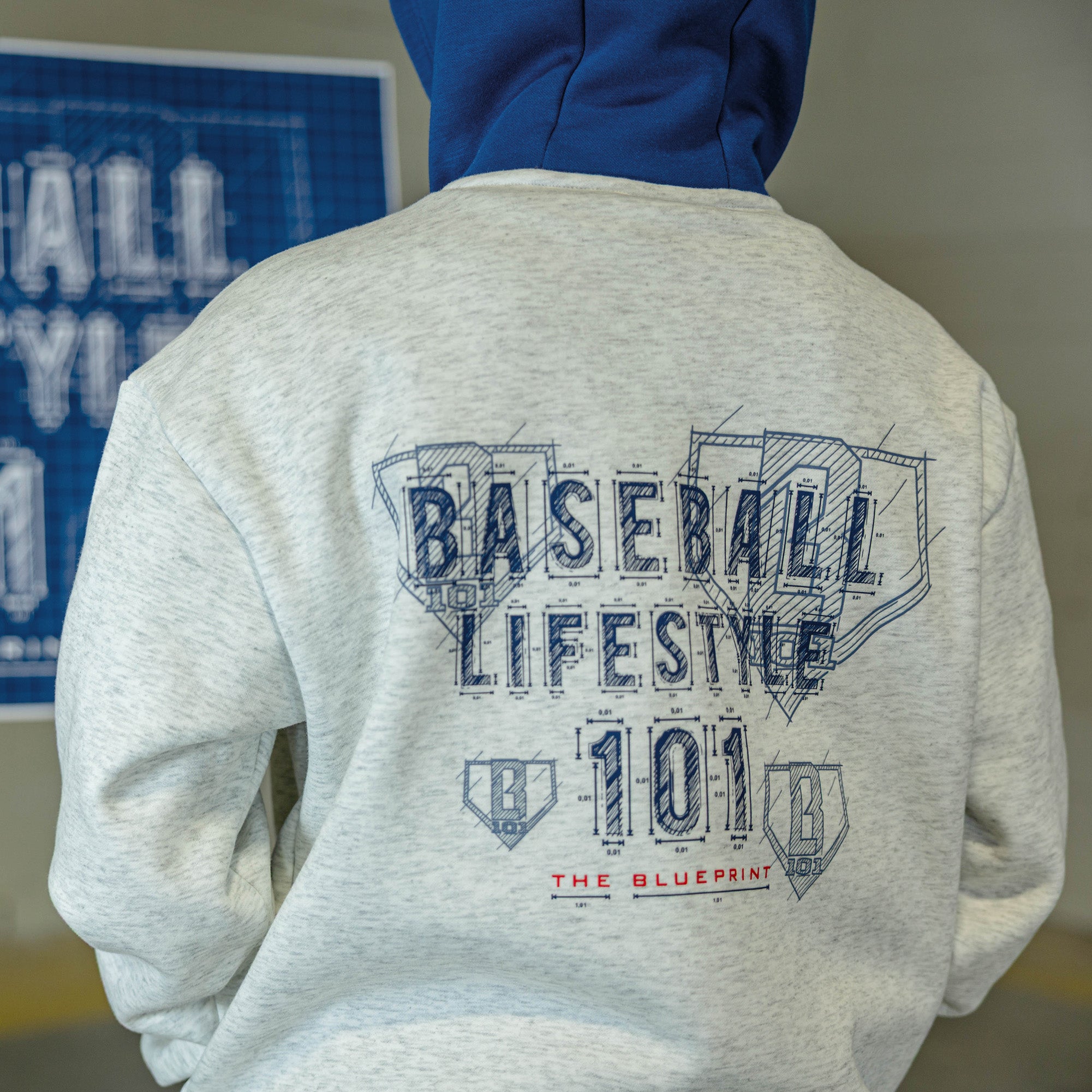Youth model wearing gray Blueprint BL Heather Gray youth hoodie