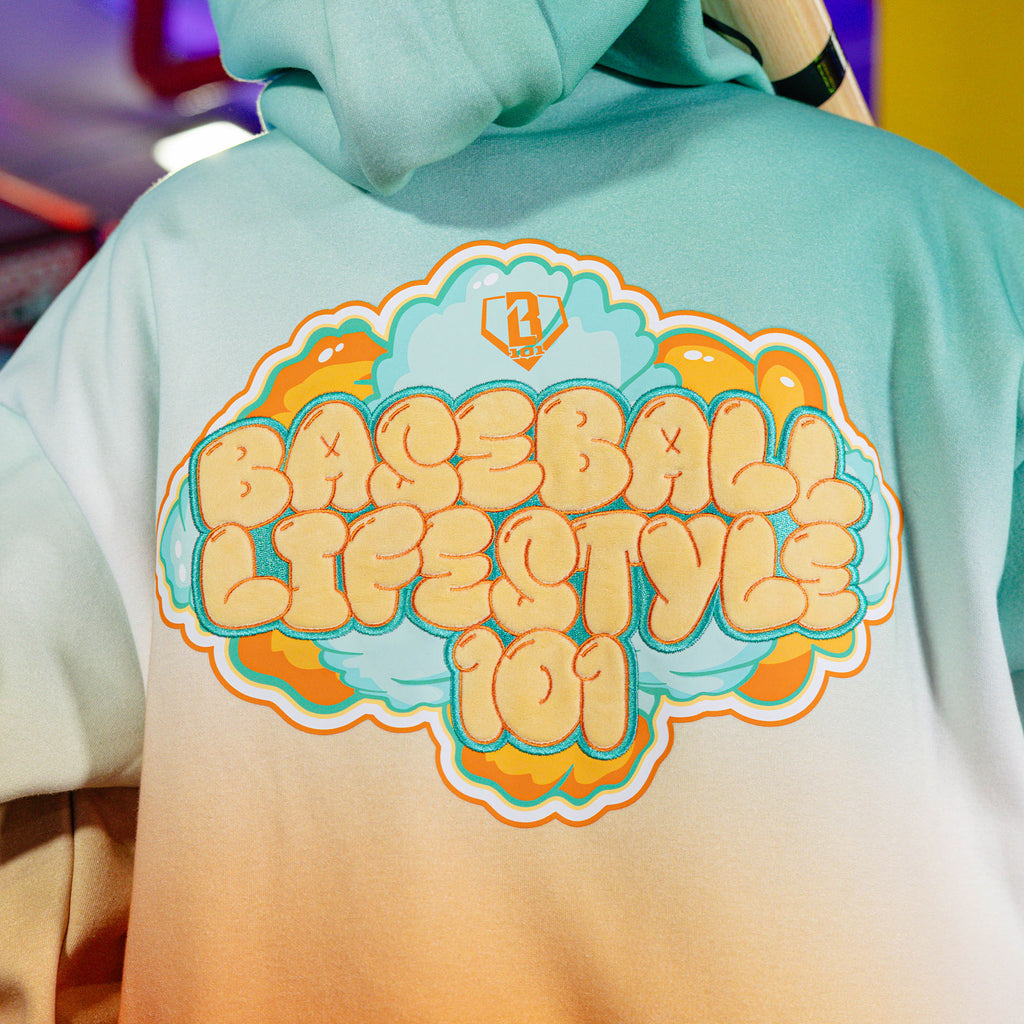 Youth model wearing Cotton Candy Tangerine Freeze youth hoodie