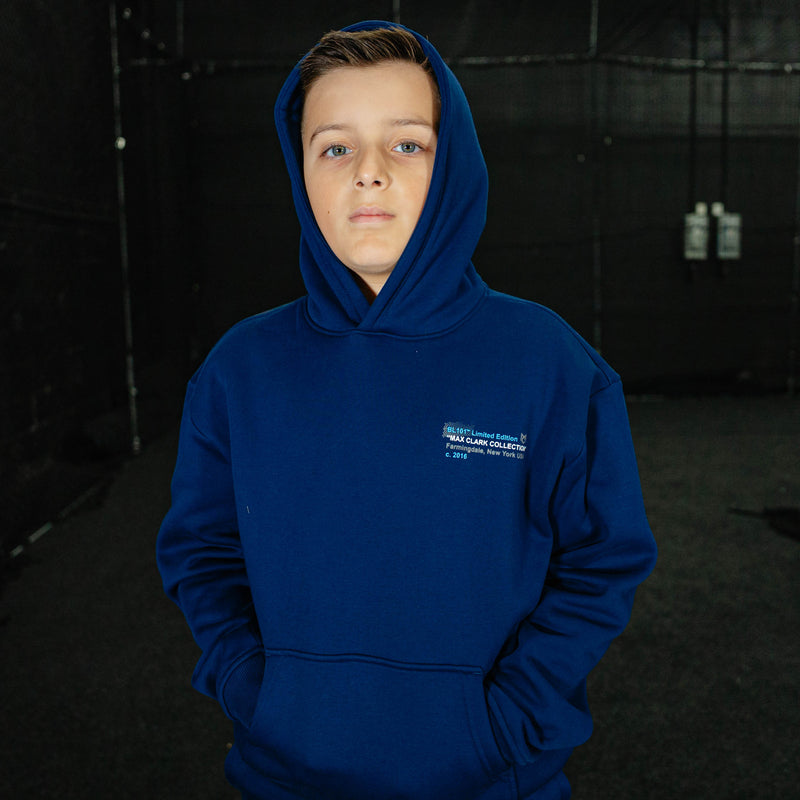 Person wearing a blue hoodie with a logo on a dark background