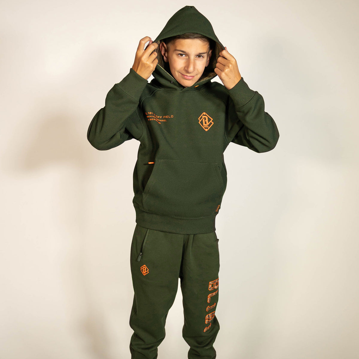 Youth model wearing green Realtree Legacy Off-Field Waffle Performance Camo youth hoodie