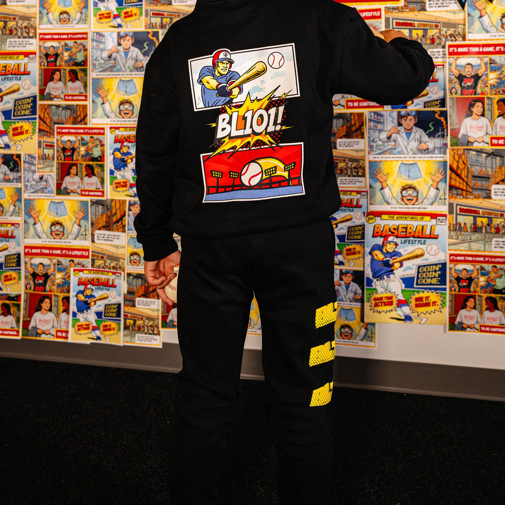 Youth model wearing black youth sweatpants with "Power Hitter" design