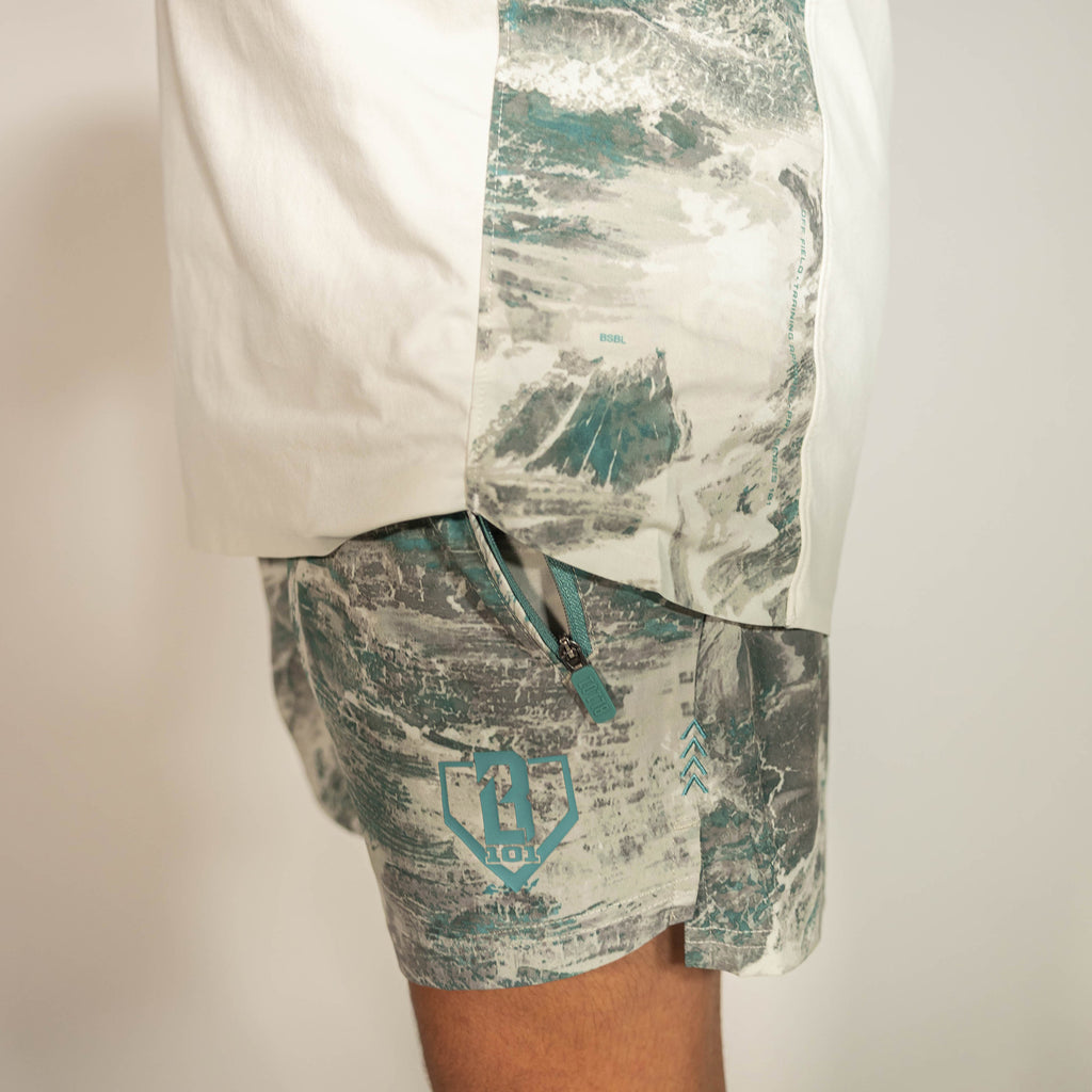 Youth model wearing gray Realtree Aspect Pro Series V2 Camo youth shorts with liner