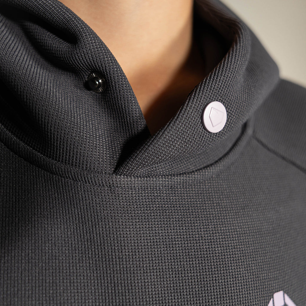 Youth model wearing gray and lilac Off-Field Waffle Performance youth hoodie