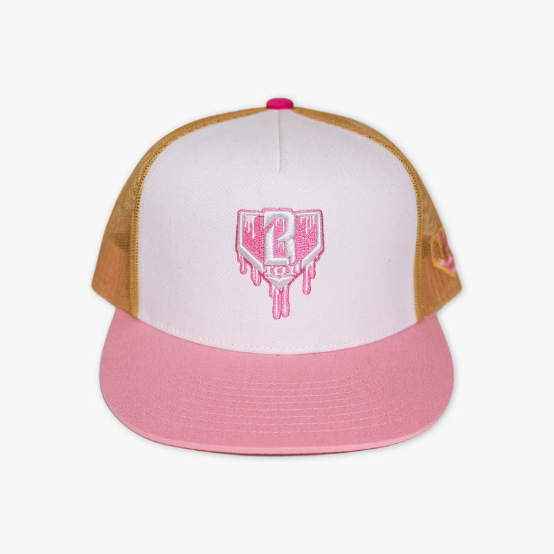 Adult model wearing white and pink Drip Mesh Off Field Snapback snapback