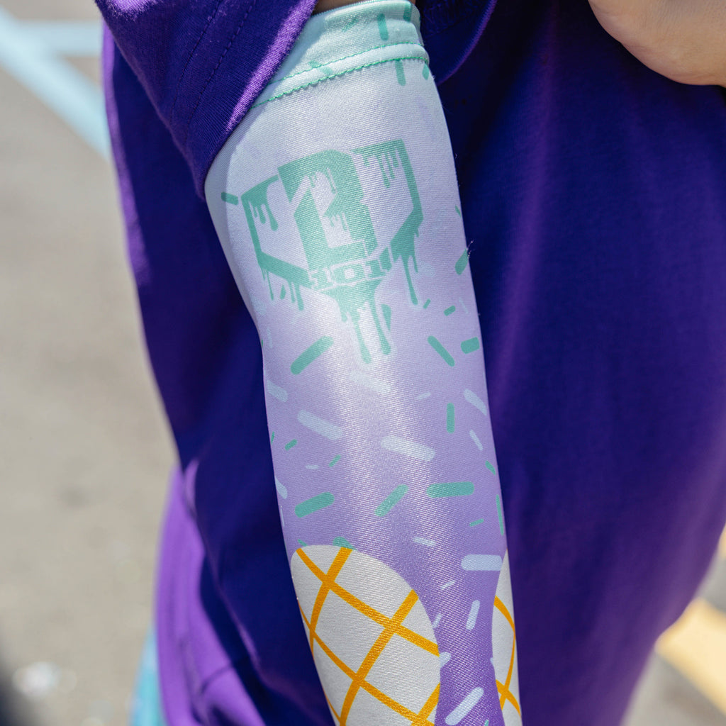 Youth model wearing ice Cream Arm Sleeve Purple Mint youth sleeve