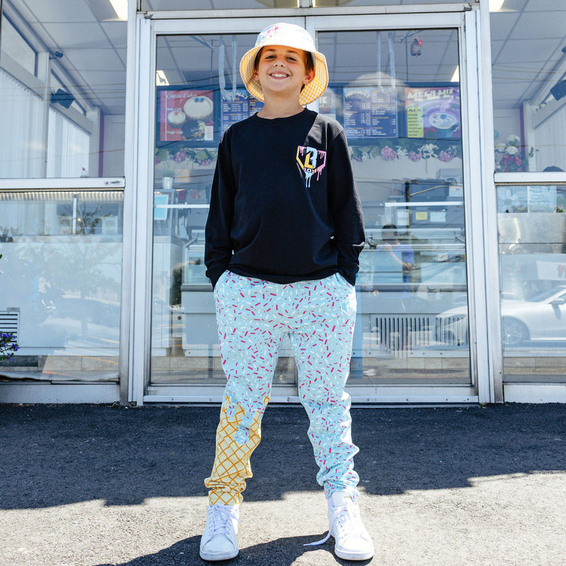 Youth model wearing ice Cream Pajama Pants Cotton Candy Blue youth pants