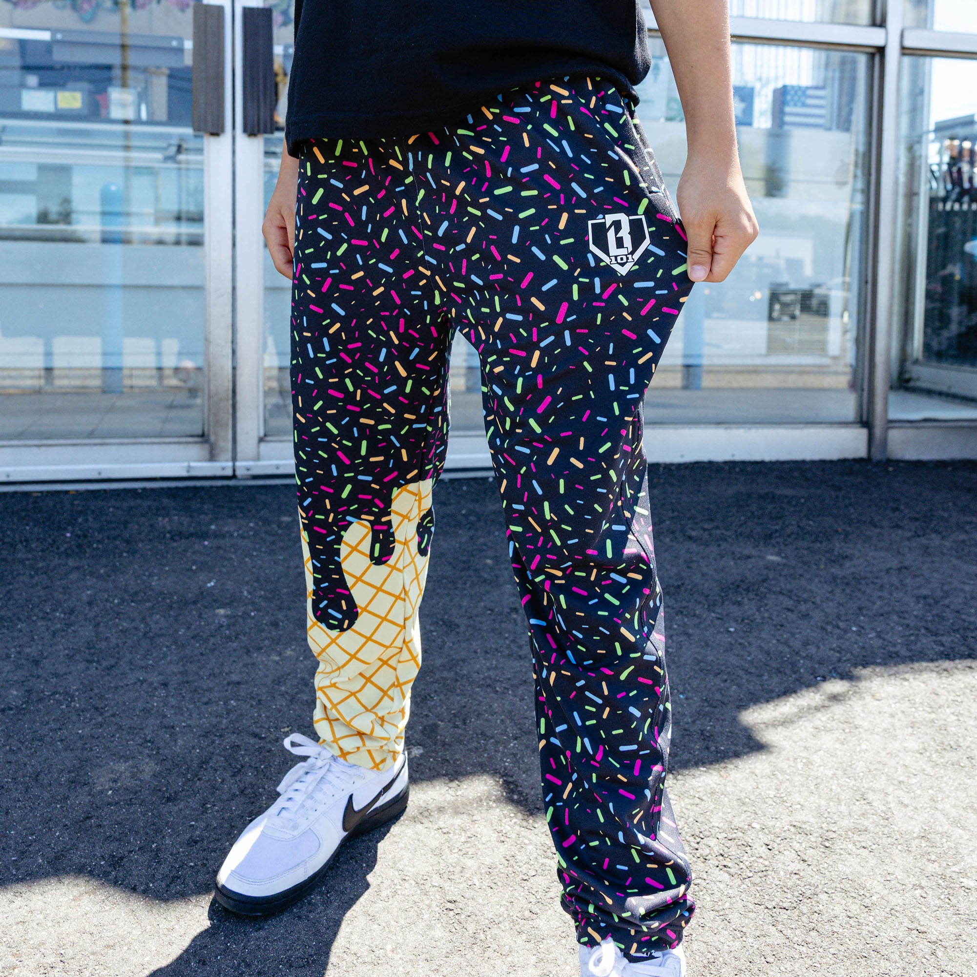 Youth model wearing ice Cream Pajama Pants Midnight Sundae youth pants