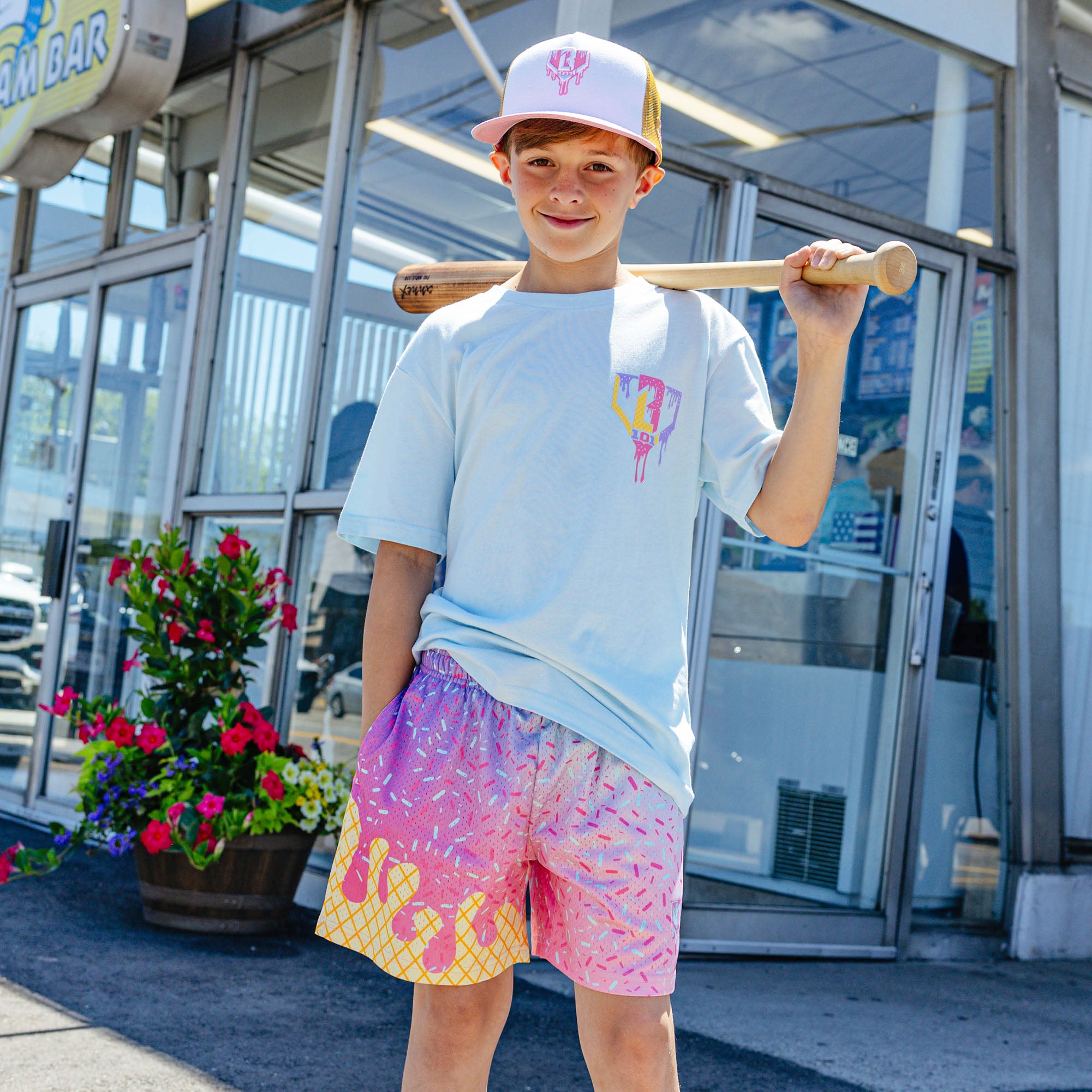 Youth model wearing blue Ice Cream Frosted youth graphic tee