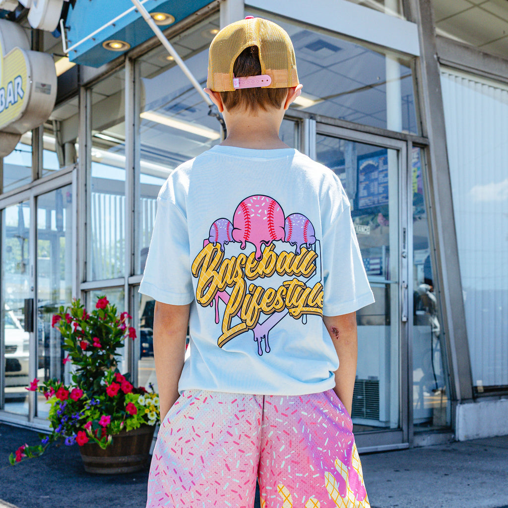 Youth model wearing blue Ice Cream Frosted youth graphic tee