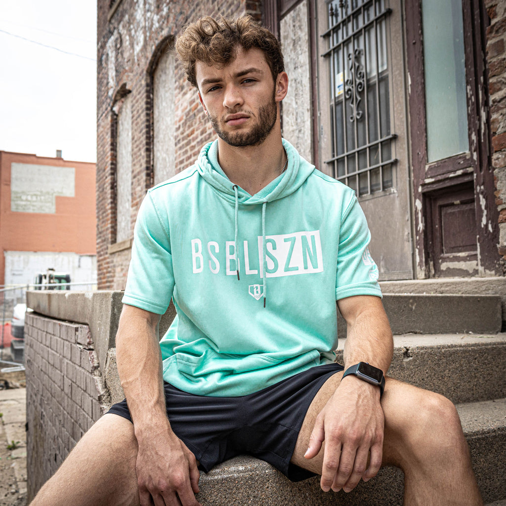 Adult model wearing mint and white BSBL-SZN short sleeve hoodie