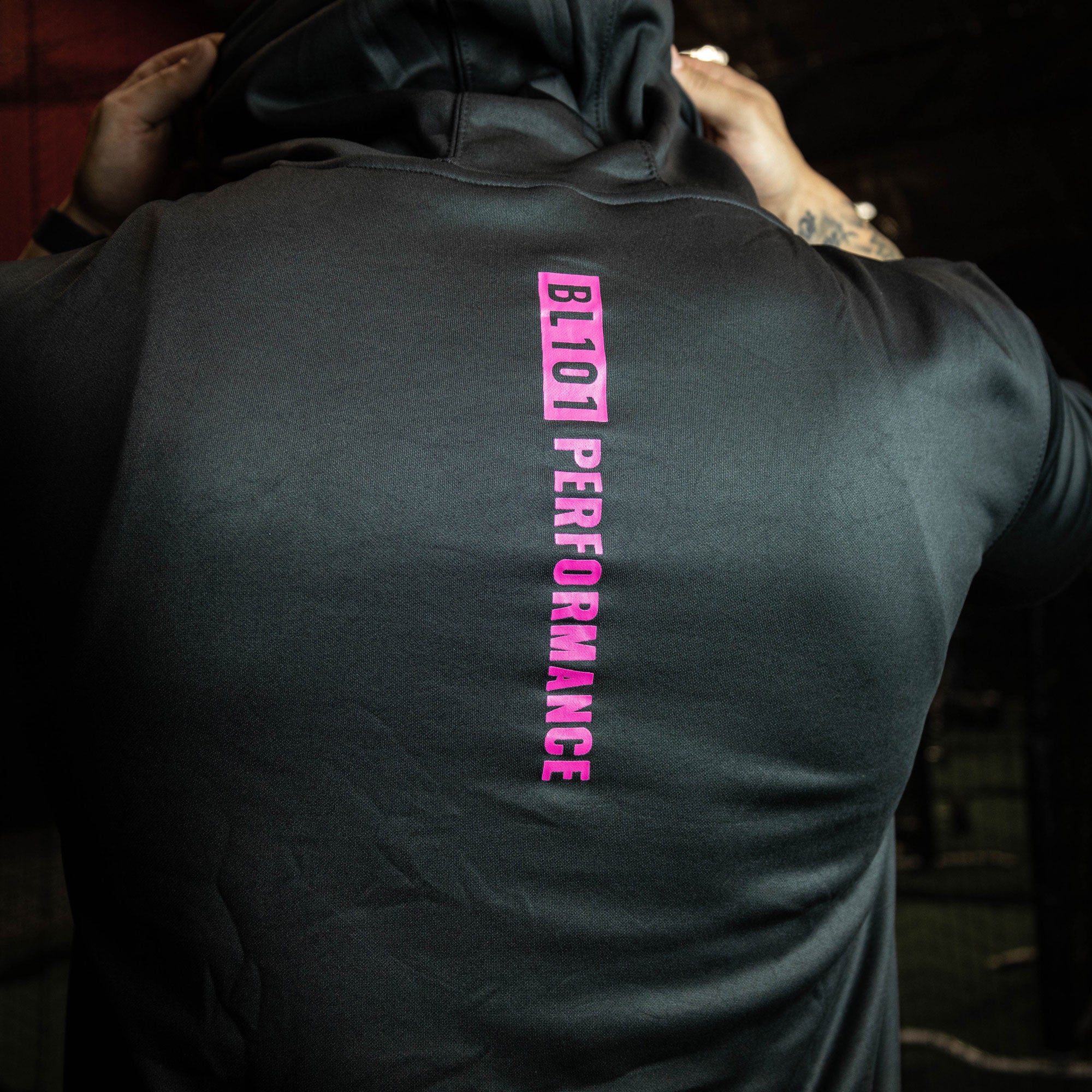 Youth model wearing black and pink BSBL-SZN youth short sleeve hoodie