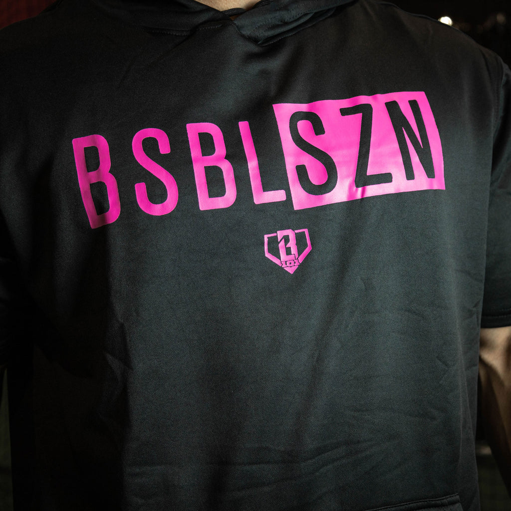 Youth model wearing black and pink BSBL-SZN youth short sleeve hoodie