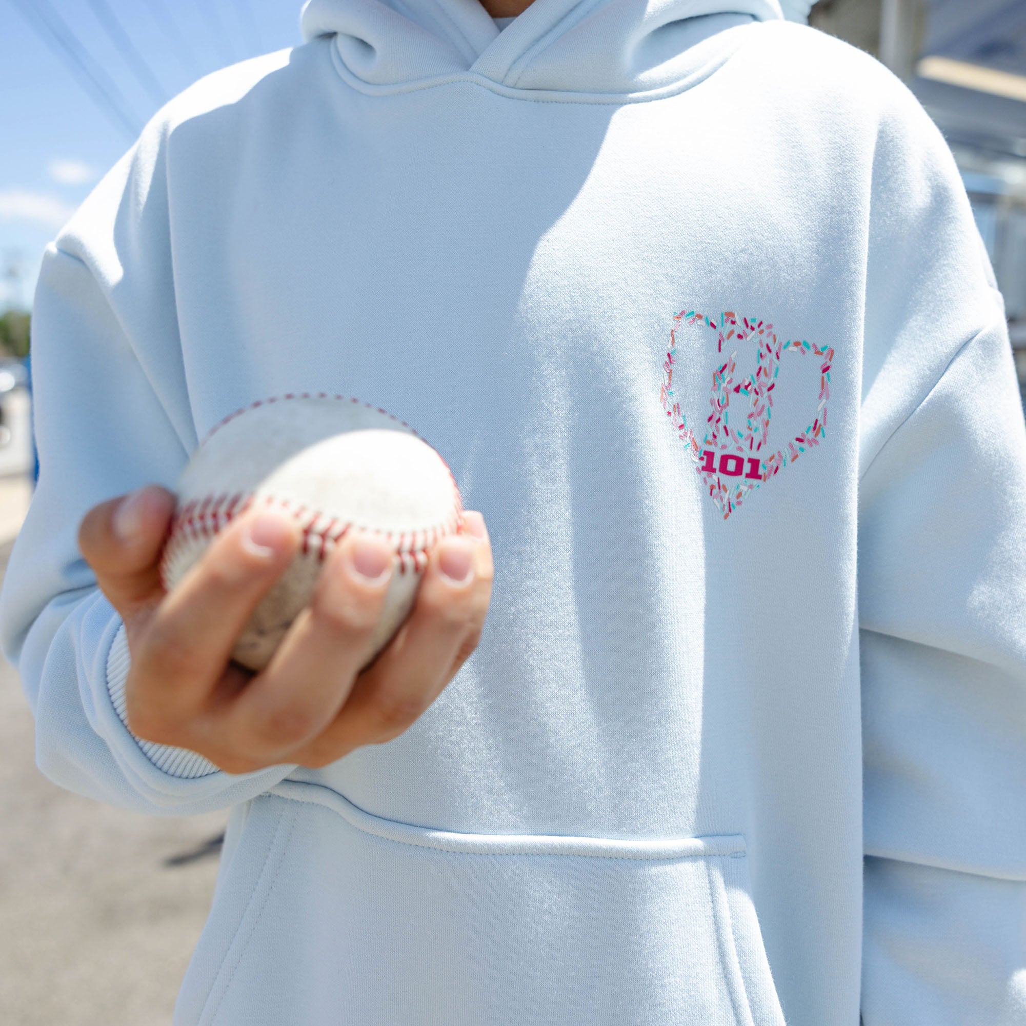 Youth model wearing youth hoodie with "Safe N Sweet" design
